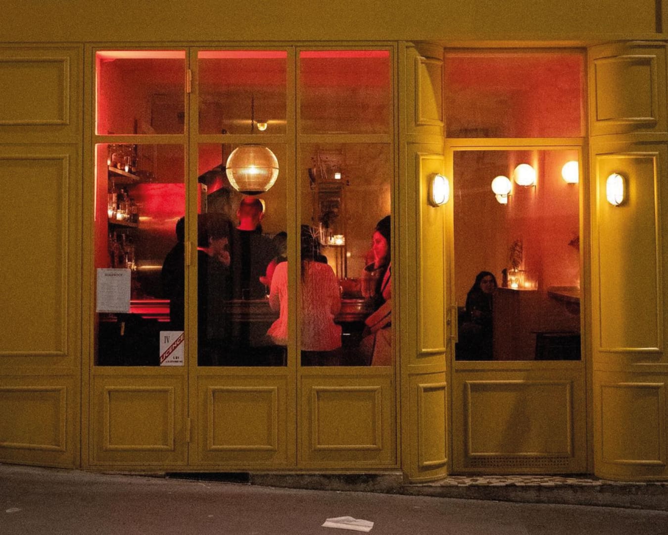 The best cocktail bars in Paris | Kissproof's yellow facade in Belleville