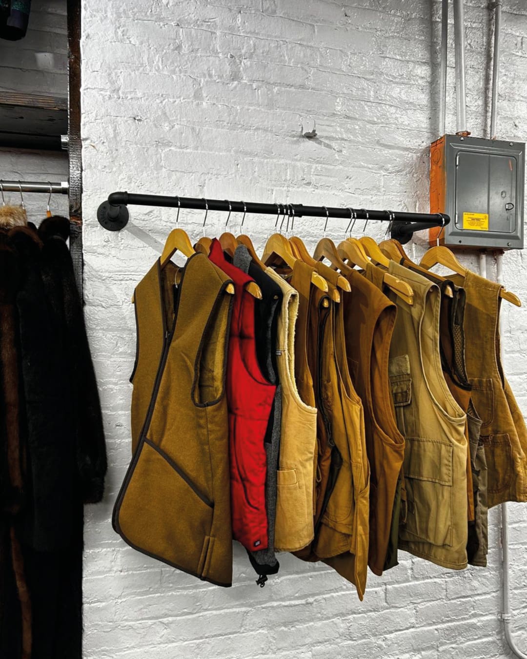 The best vintage stores in New York | sleeveless jackets on a rail at L Train