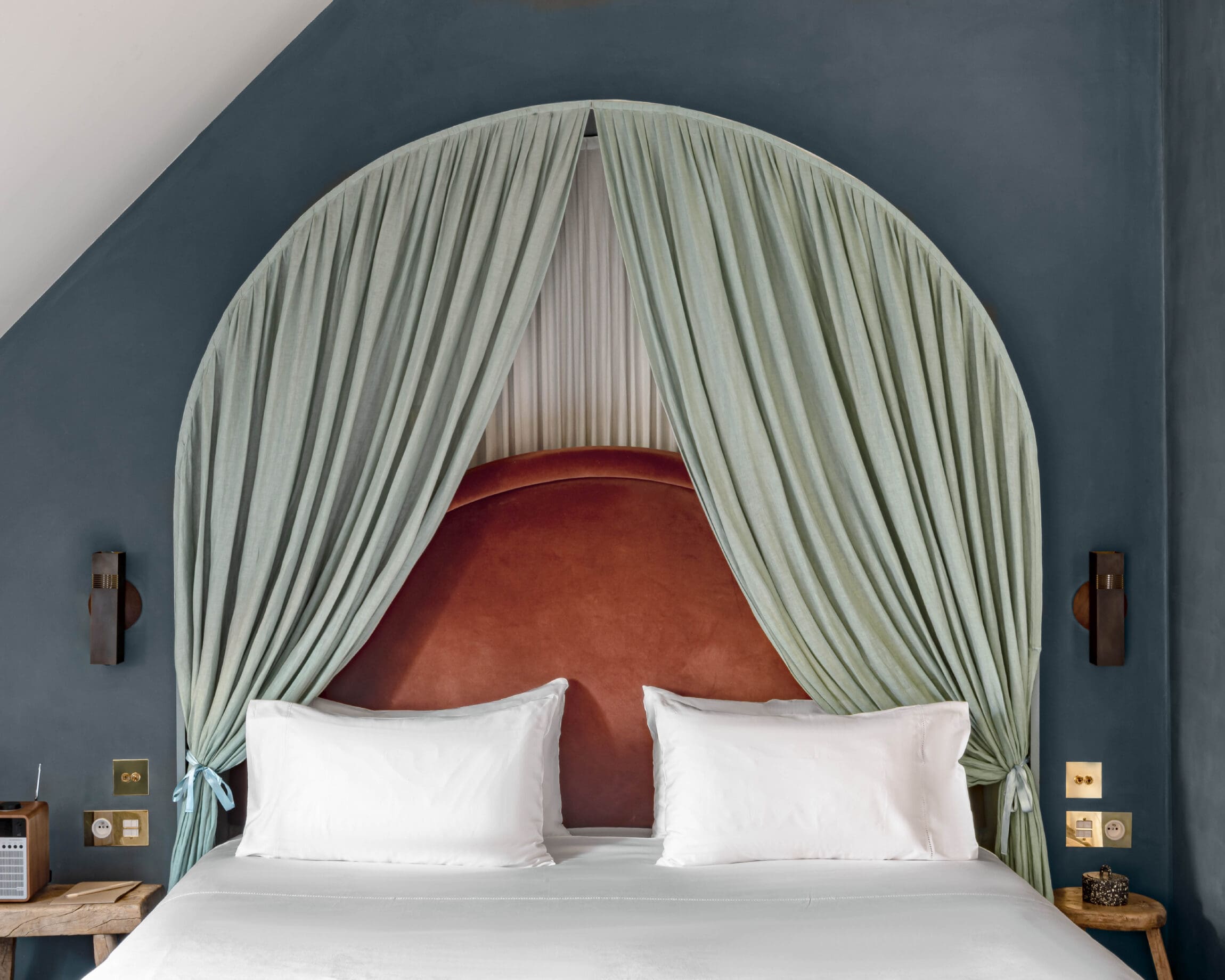 The best boutique hotels in Paris | A colourful bedroom at Hotel Des Grands Boulevards.