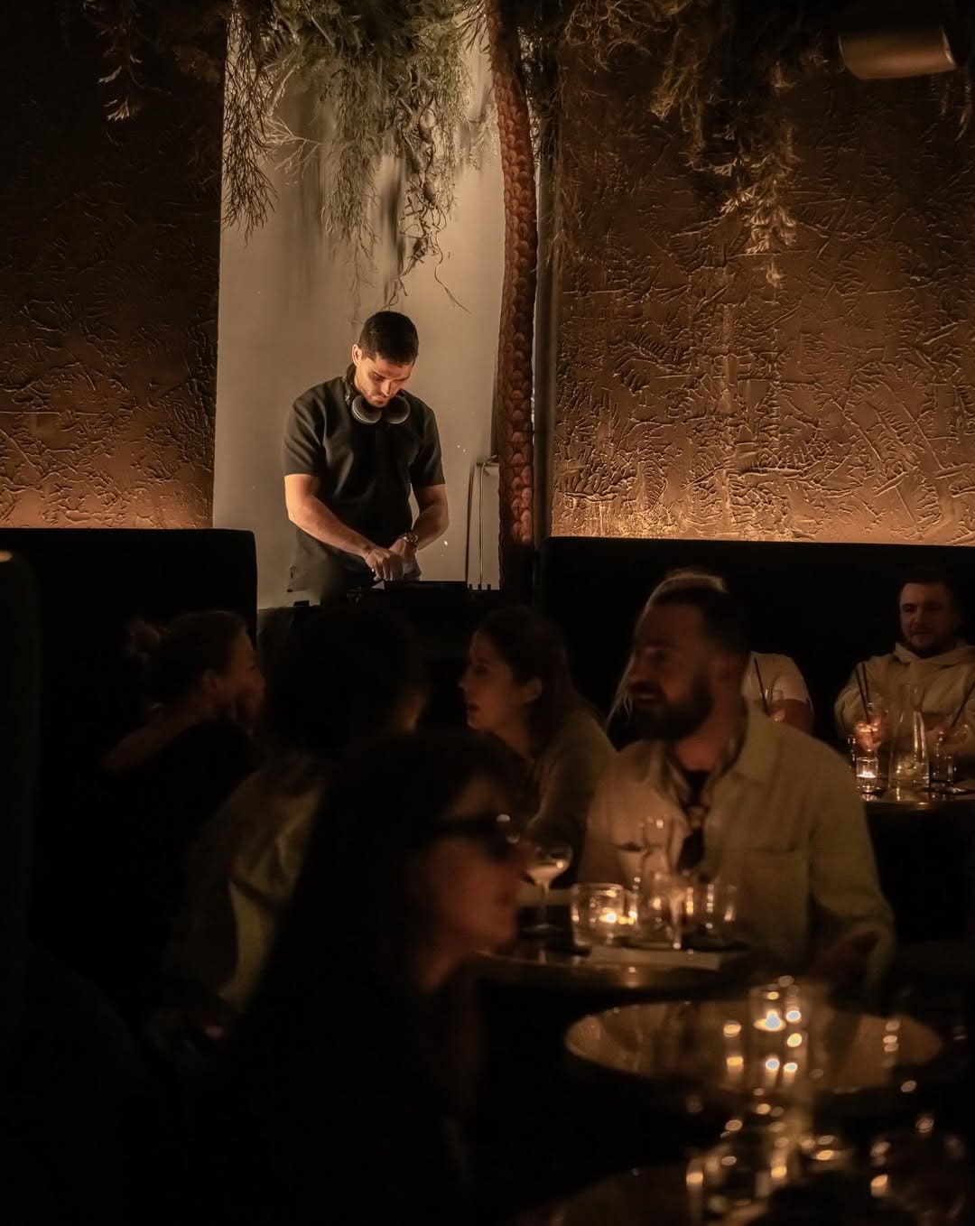 A live DJ at the buzzy Herbarium cocktail bar in Paris