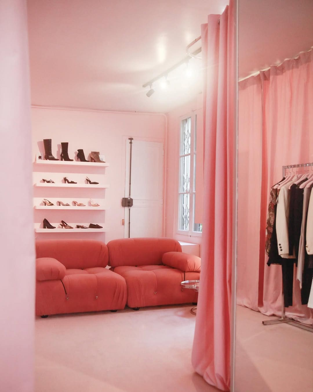 The pink hued Les Archives vintage shop in Paris