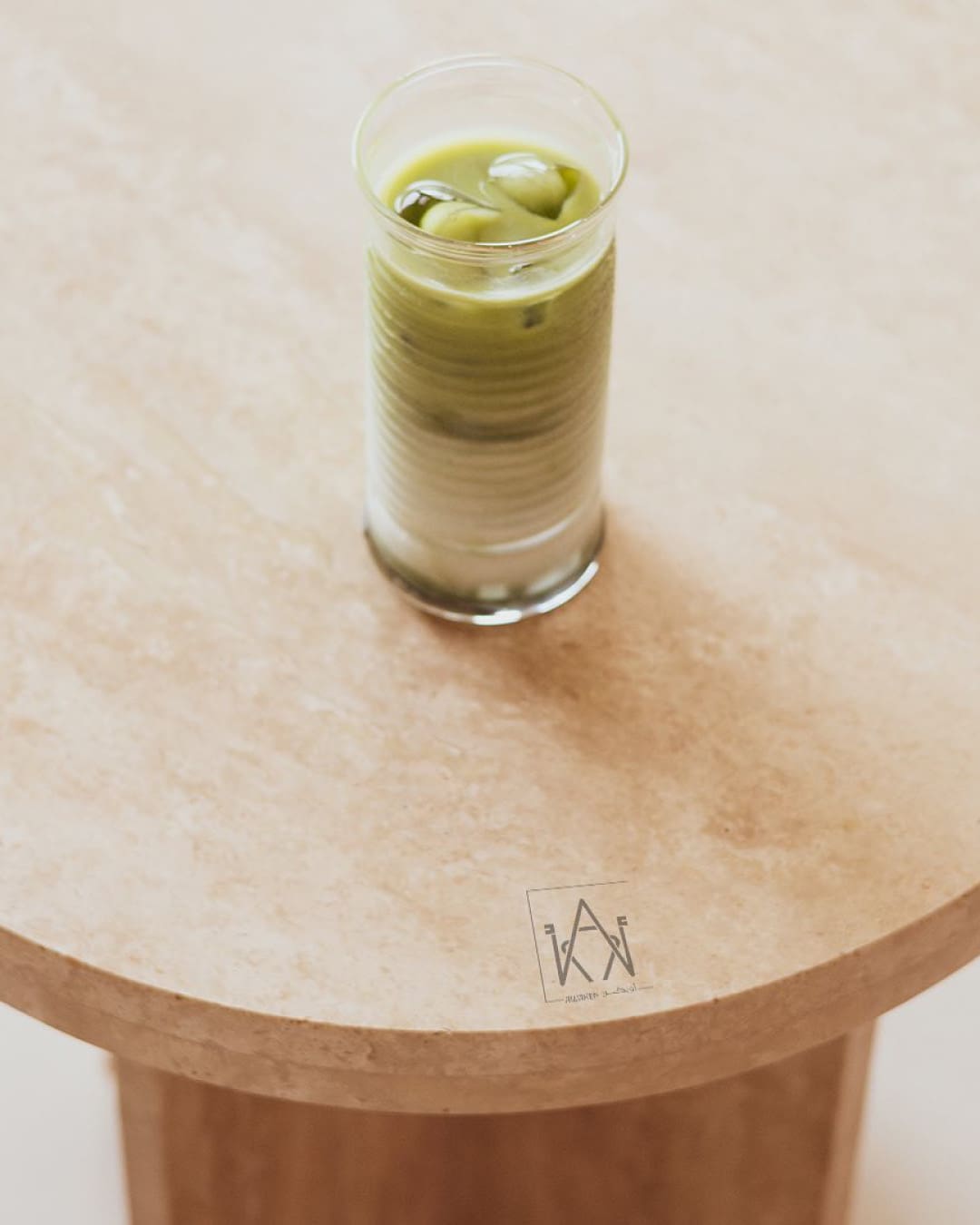 The best coffee shops in Dubai | Iced matcha latte on a wooden table