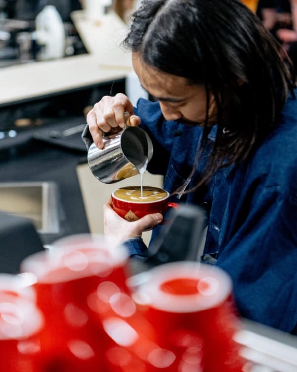 The best things to do in London this April | A barista making coffee art at London Coffee Festival