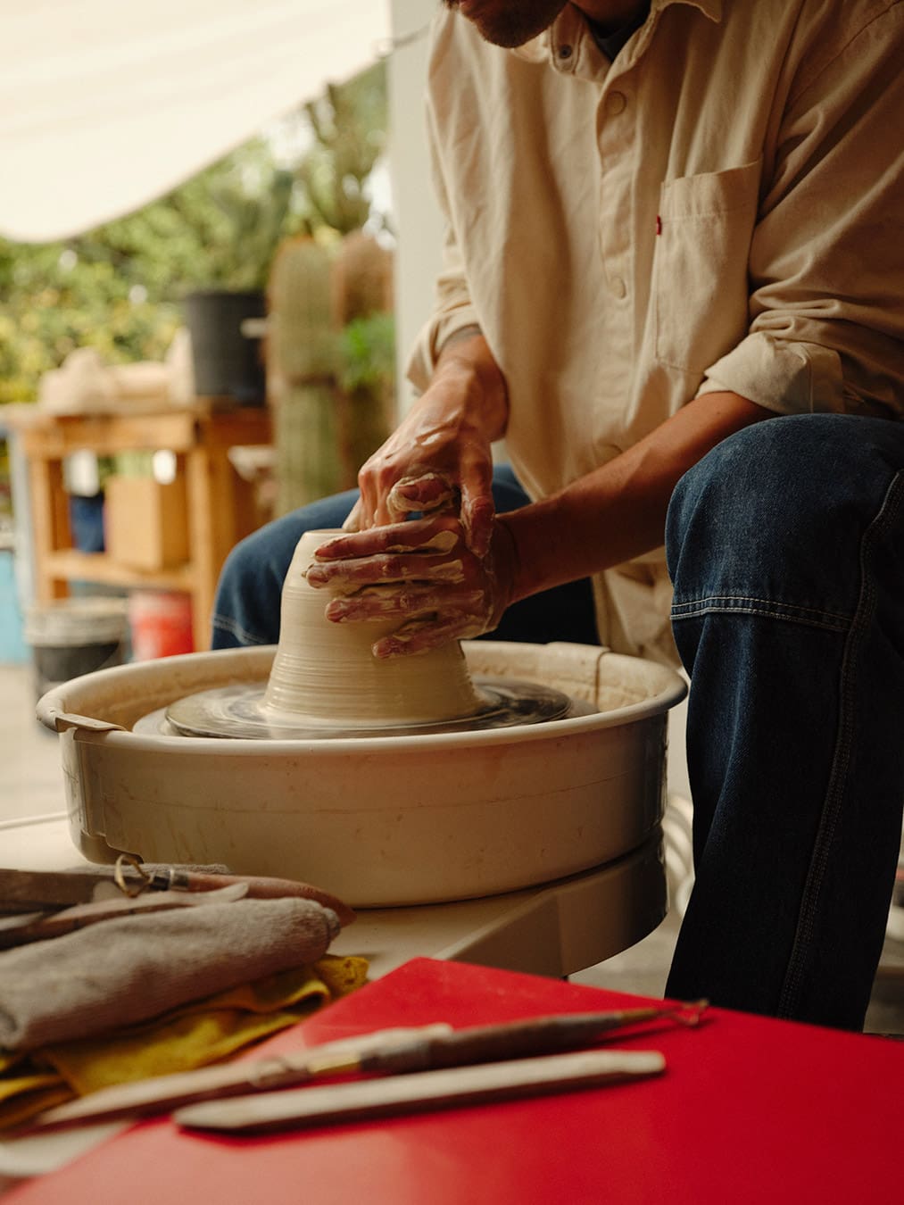 How Did I Get Here with Daniel Dooreck of Danny D's Mud Shop | Daniel Dooreck working on a pot at the wheel.