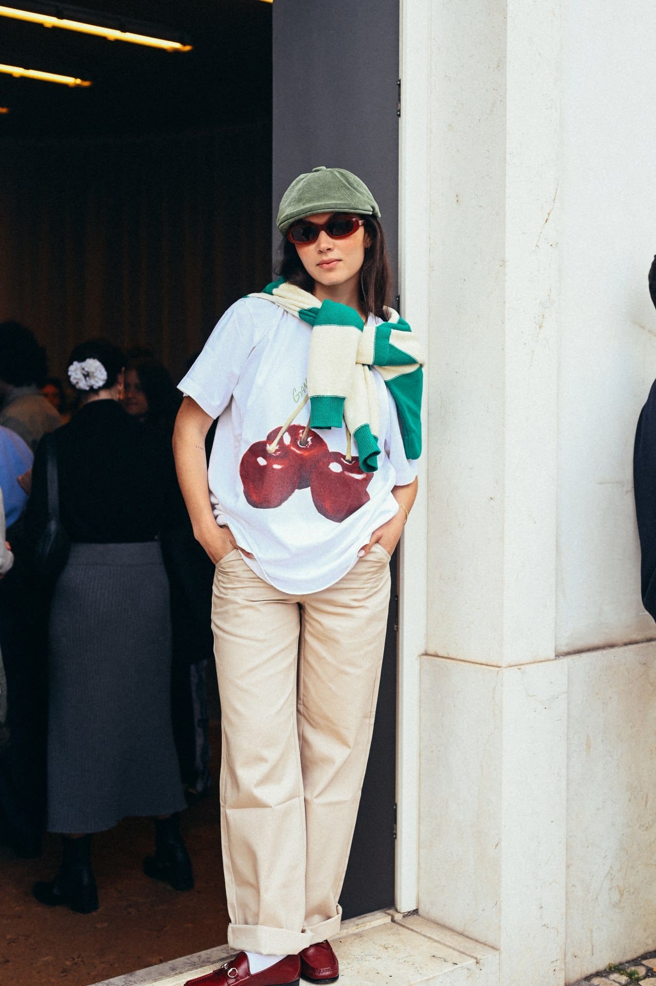 A woman in a cherry-printed top at Gandaia in Lisbon