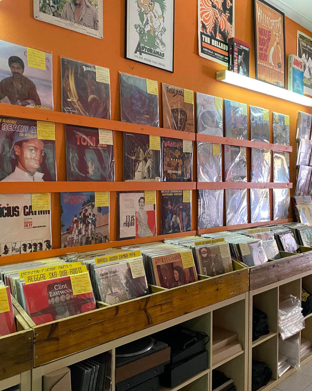 Vinyl records in their sleeves on shelves and in crates at Groovie Records shop in Lisbon.