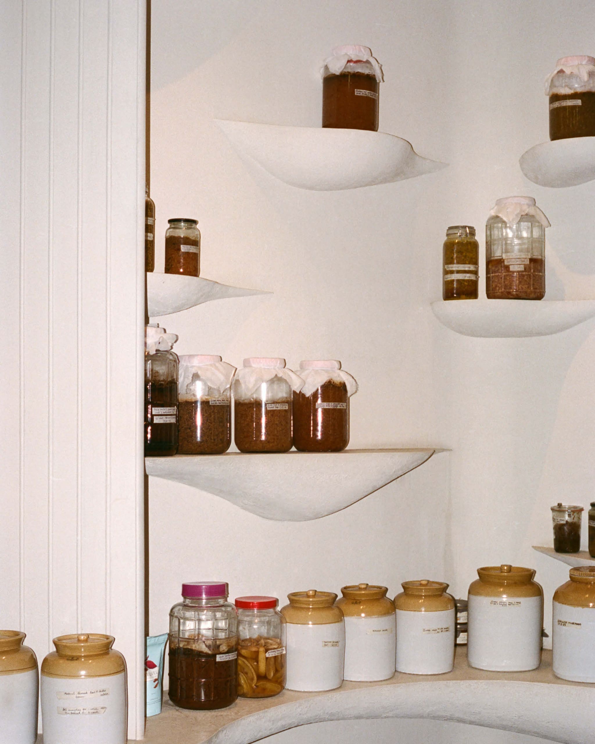 Pickles in jars on shelves at Noon in Mumbai.