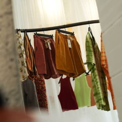 Colourful clothes hang on a rail in Mustique in Lisbon.