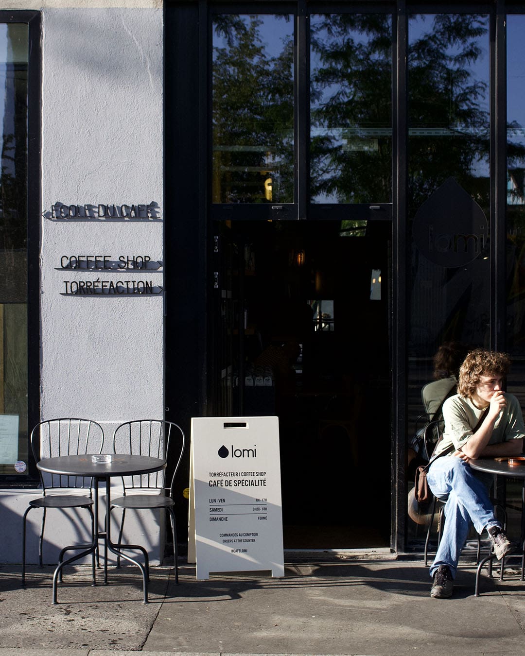 Outside Lomi coffee shop Paris.