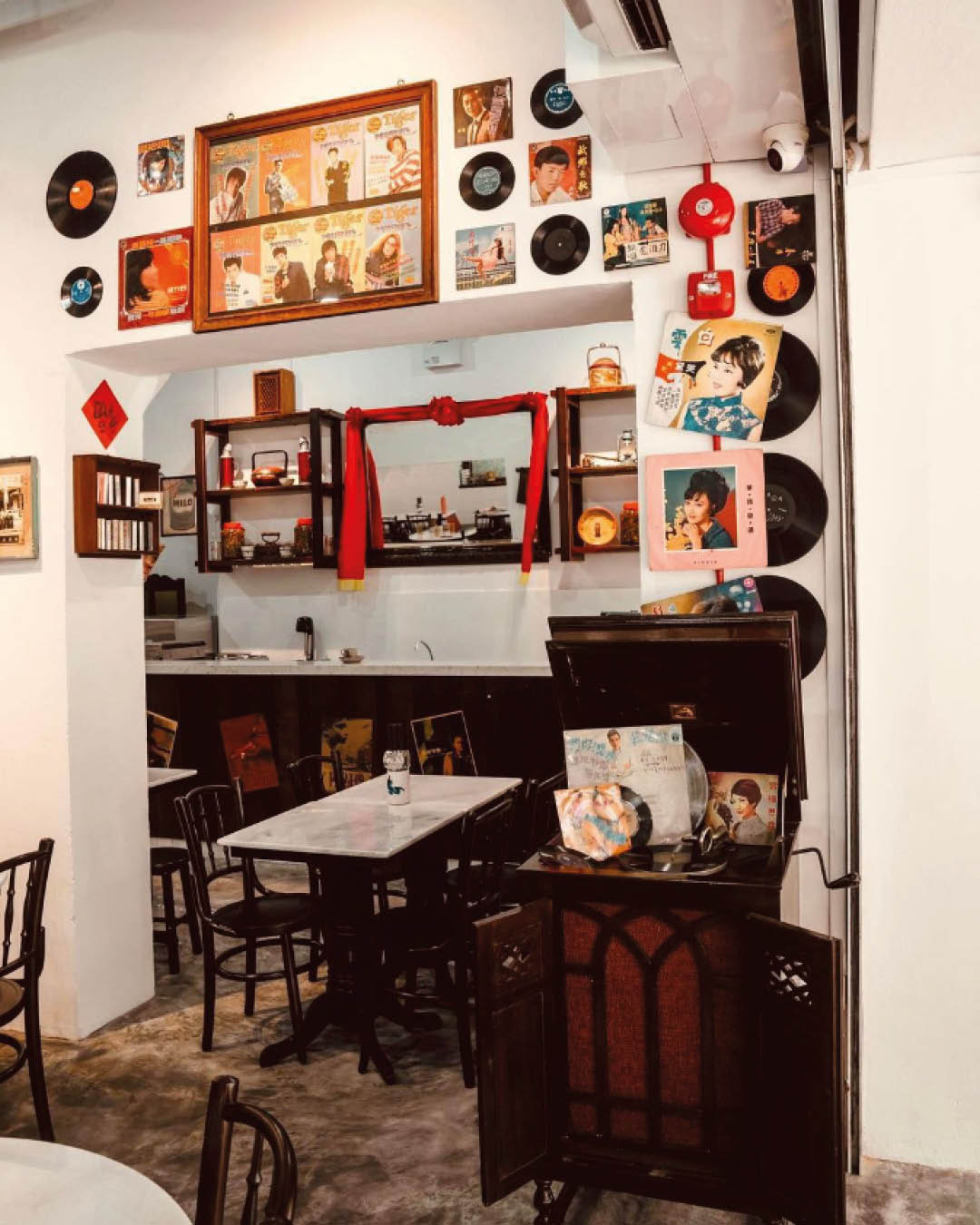 Record sleeves and other memorabilia decorate the walls at Great Nanyang Heritage Cafe.