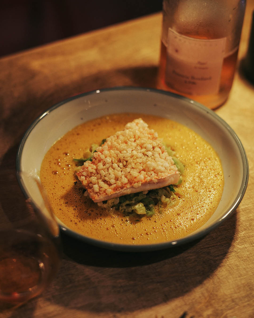 Sarawak laksa bouillabaisse served at Wine RVLT Singapore.