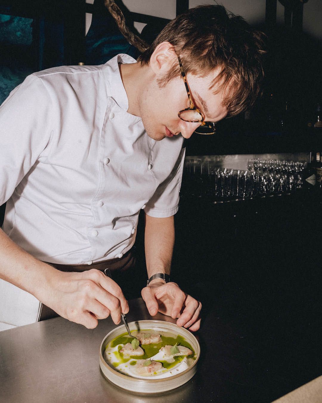 A chef adds the final touches to a dish at Shoreditch Arts Club