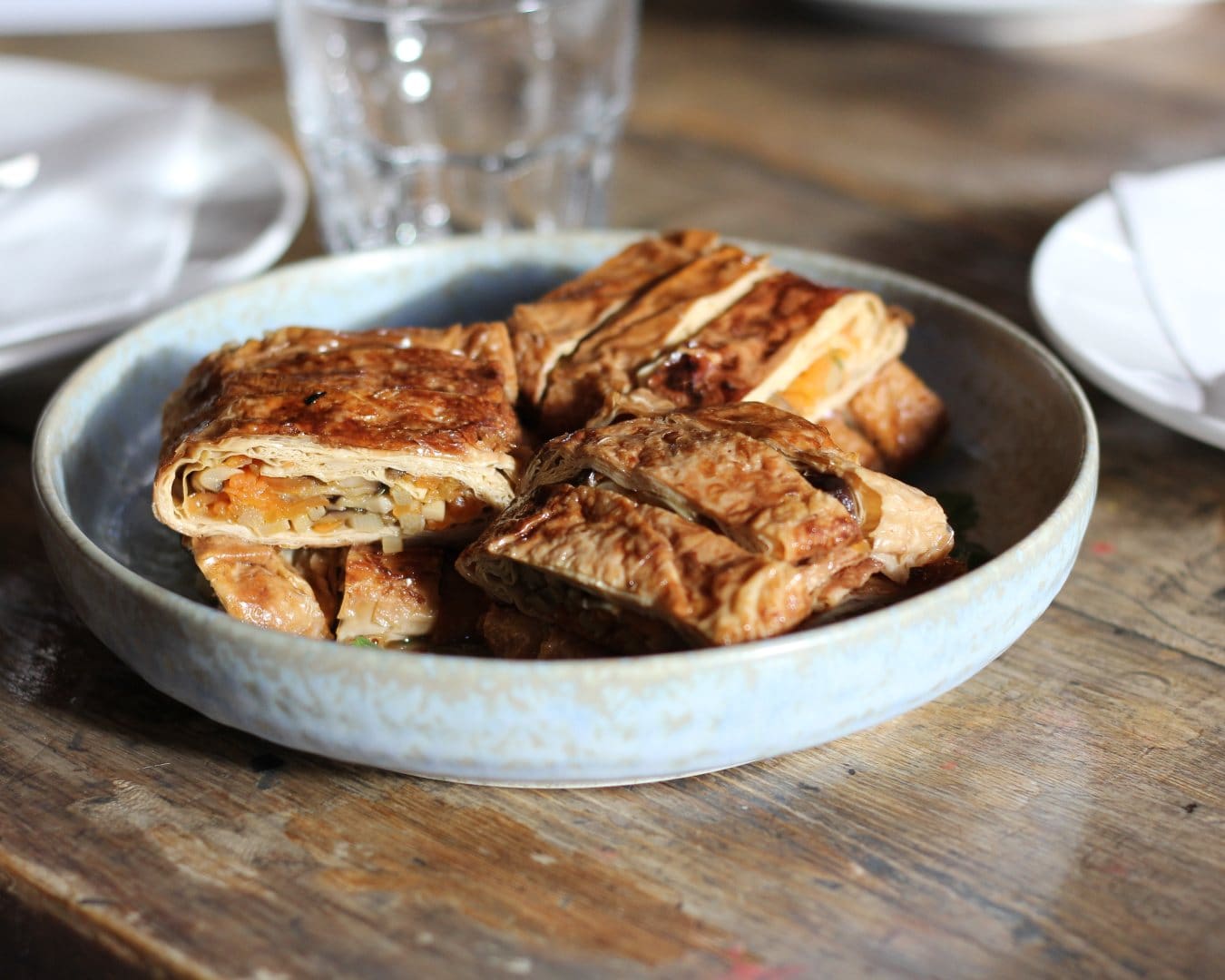 A tofu skin roll stuffed with shiitake mushroom, bamboo shoots and carrots