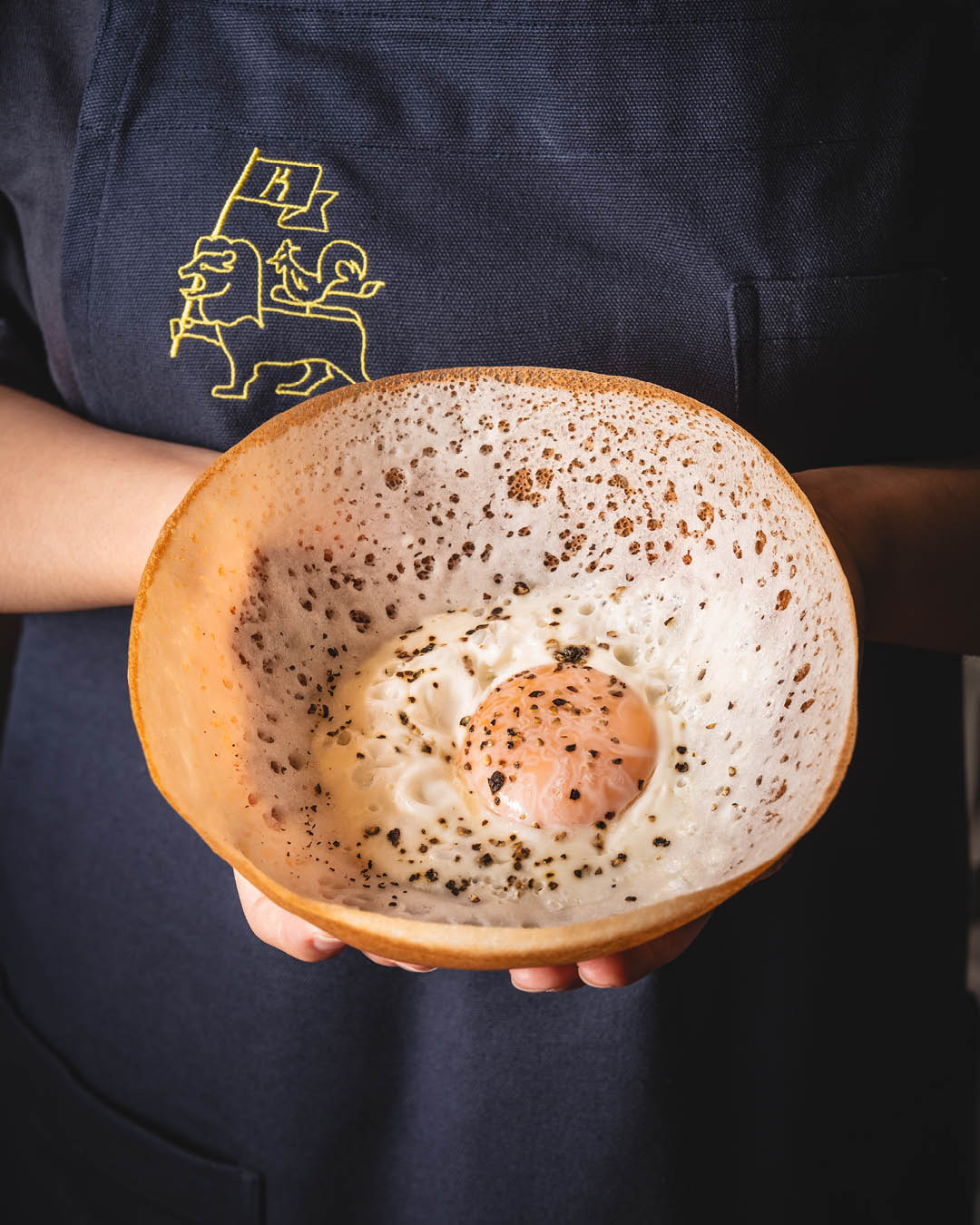 A crispy hopper served with a fried egg at Kotuwa restaurant, Singapore.