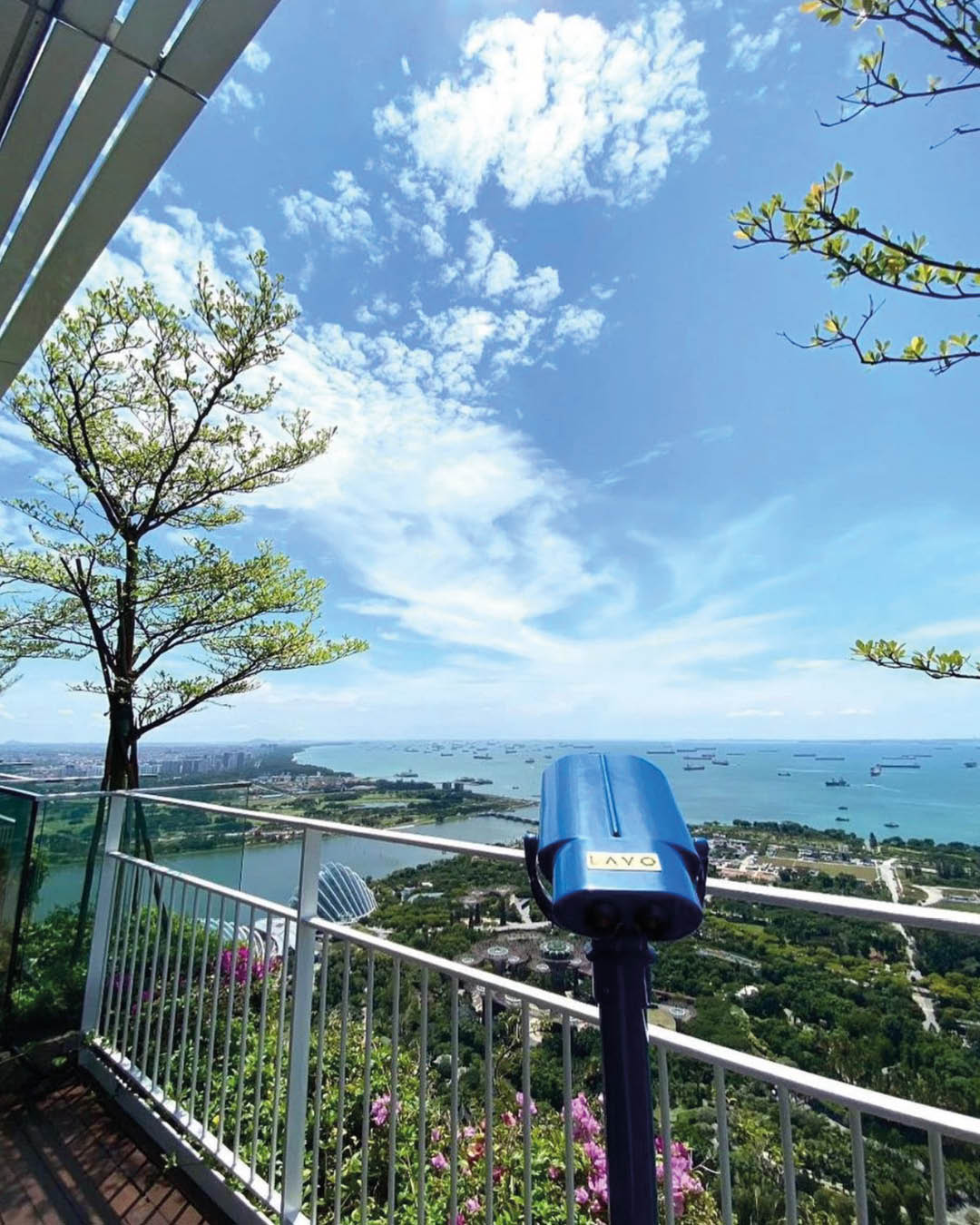 A telescope looking over the coast at rooftop restaurant and bar LAVO Singapore.