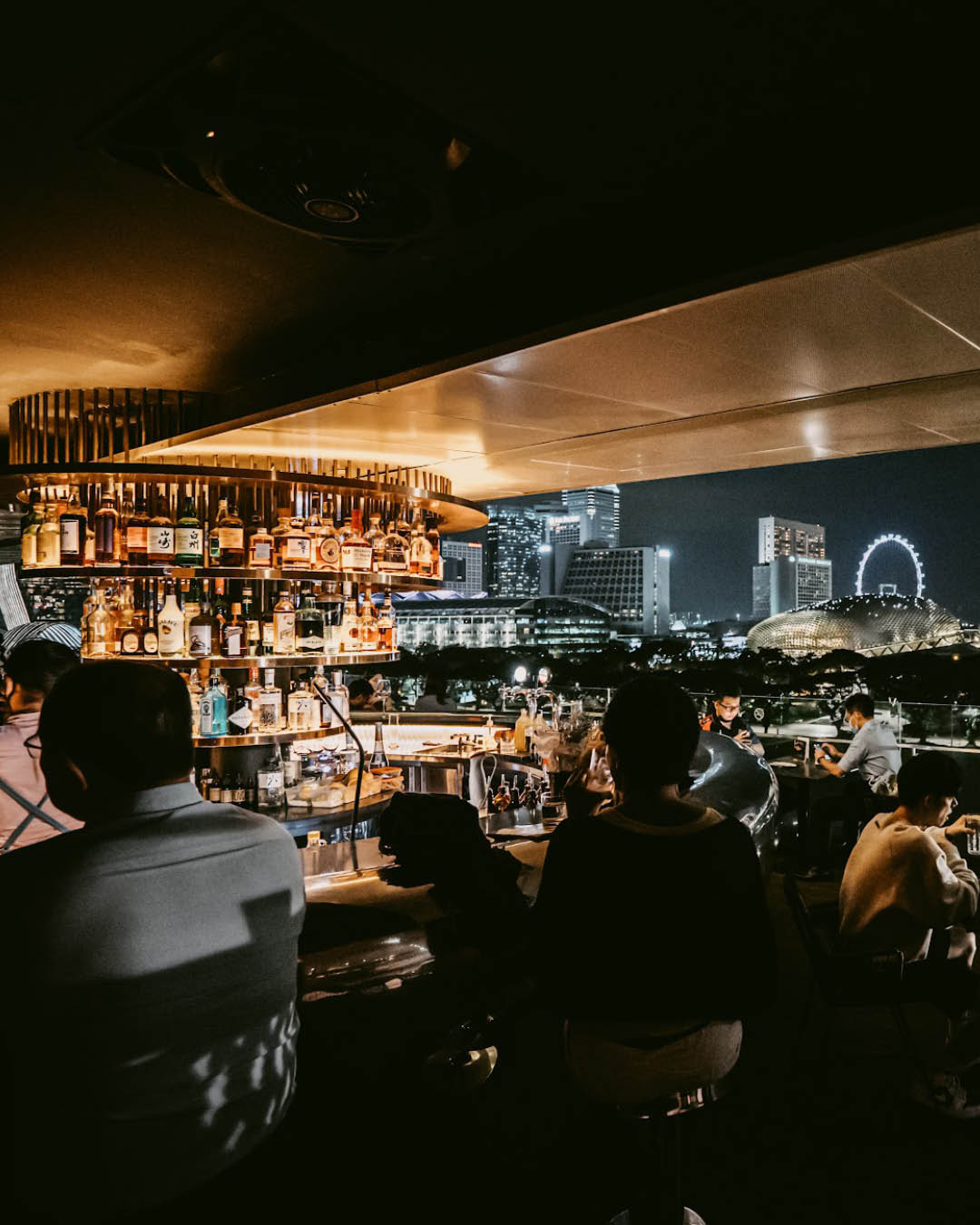 The bar at Smoke & Mirrors at night in Singapore.