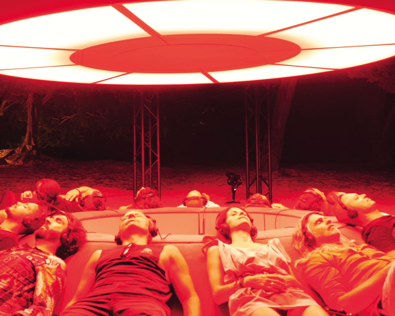 People mediate beneath infrared light at Glow Festival in Singapore