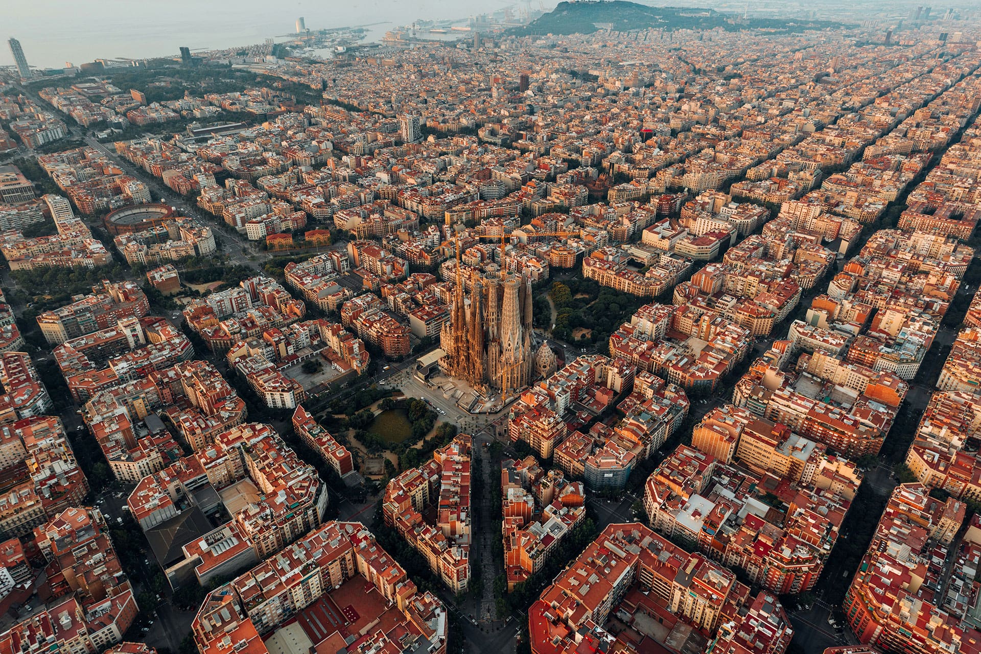 An aerial view of the city of Barcelona with the Sagrada Familia at the centre.