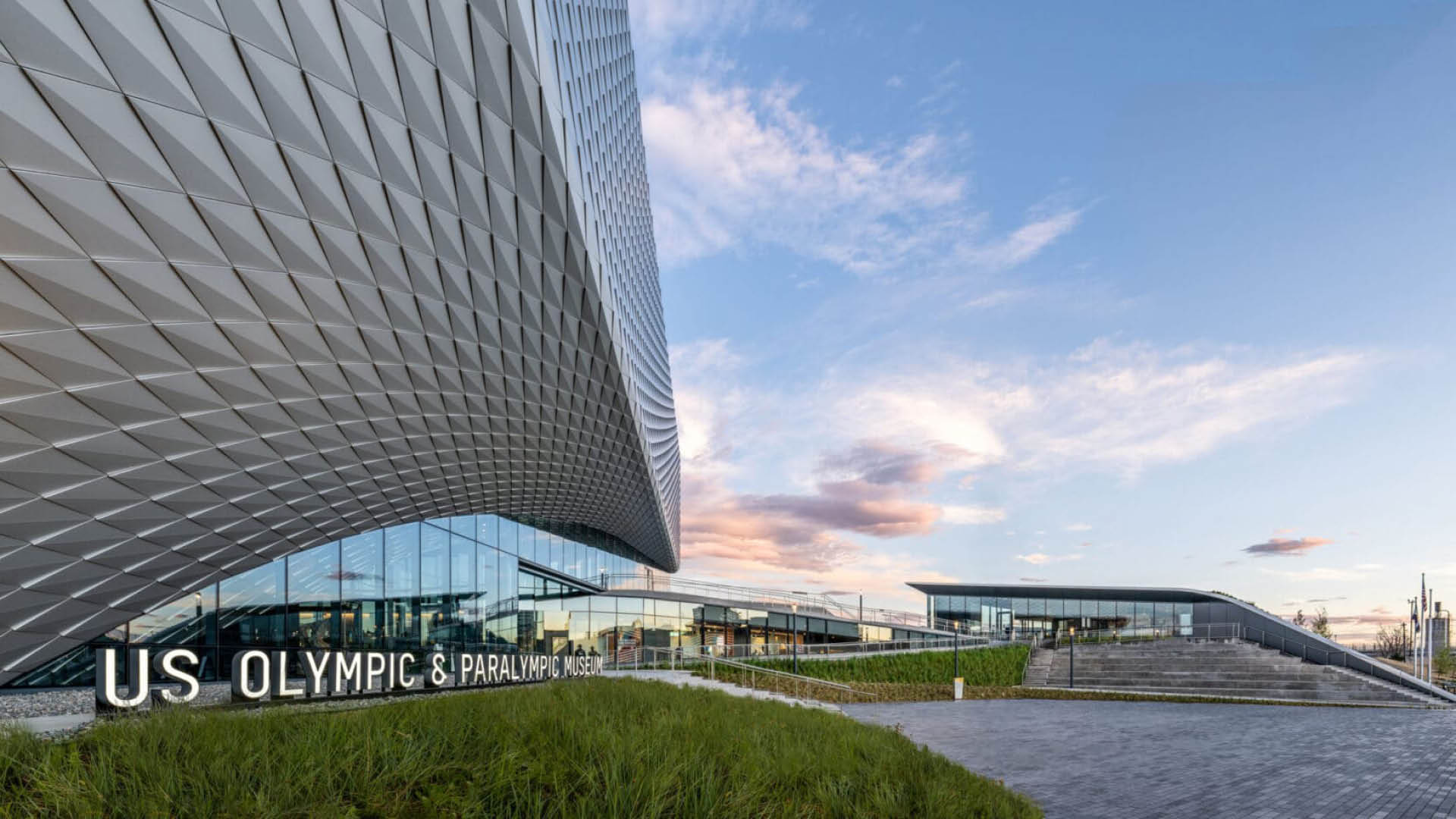 The entrance and facade of the US Olympic and Paralympic Museum in Colorado Springs, an accessible travel destination.