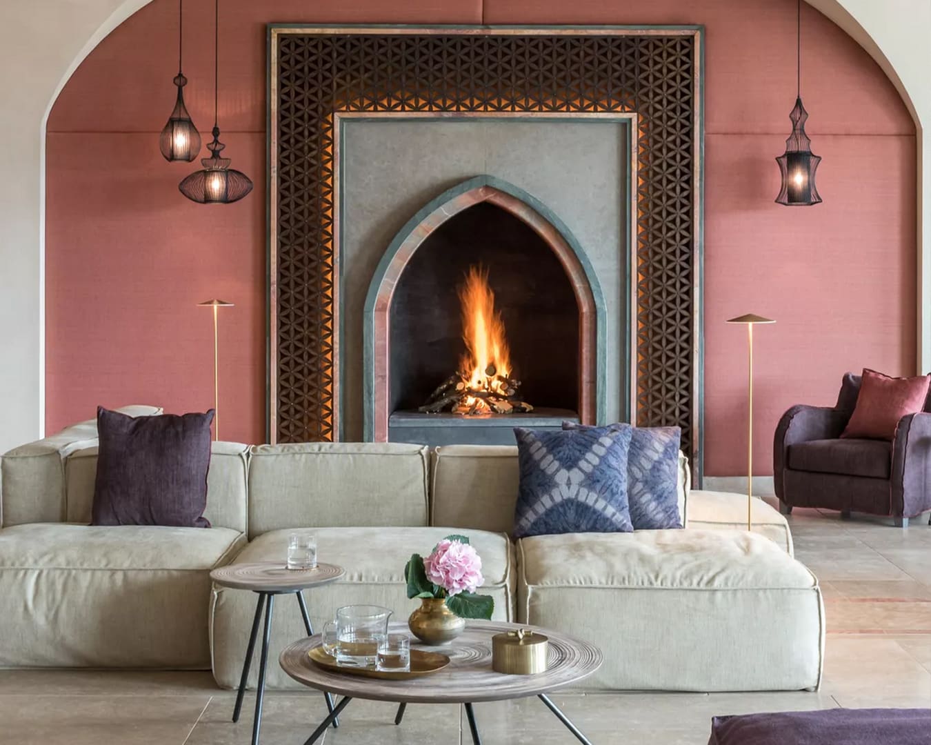 A roaring fire in a cosy living space at Euphoria Retreat in Peloponnese, Greece