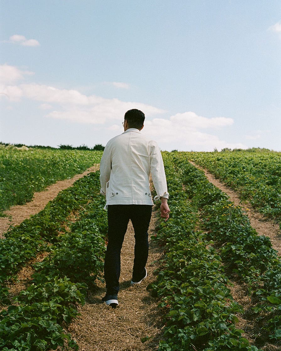 Chef Kristian Baumann in a strawberry field