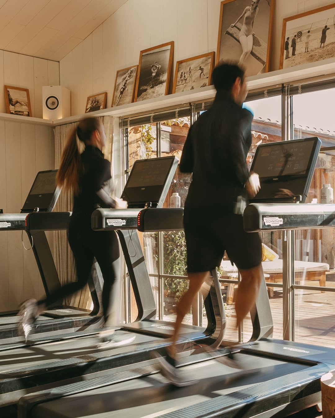 Fitness & Wellness Retreats | Two people running on treadmills looking onto a pool at Lily of the Valley in Provence, France