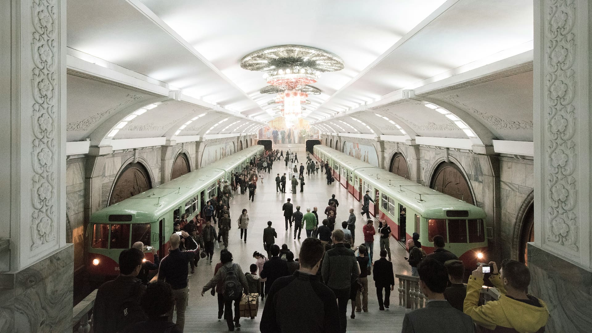 Tourists photograph the Pyongyang Metro, North Korea