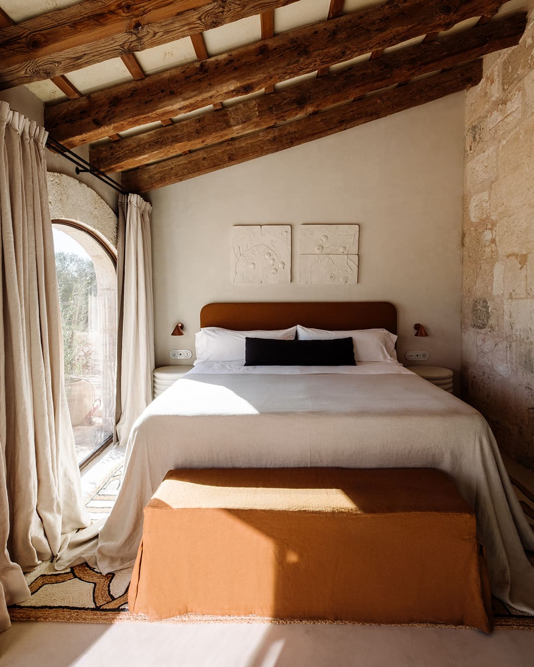 Boho chic bedroom at Wylder wellness retreat in Menorca