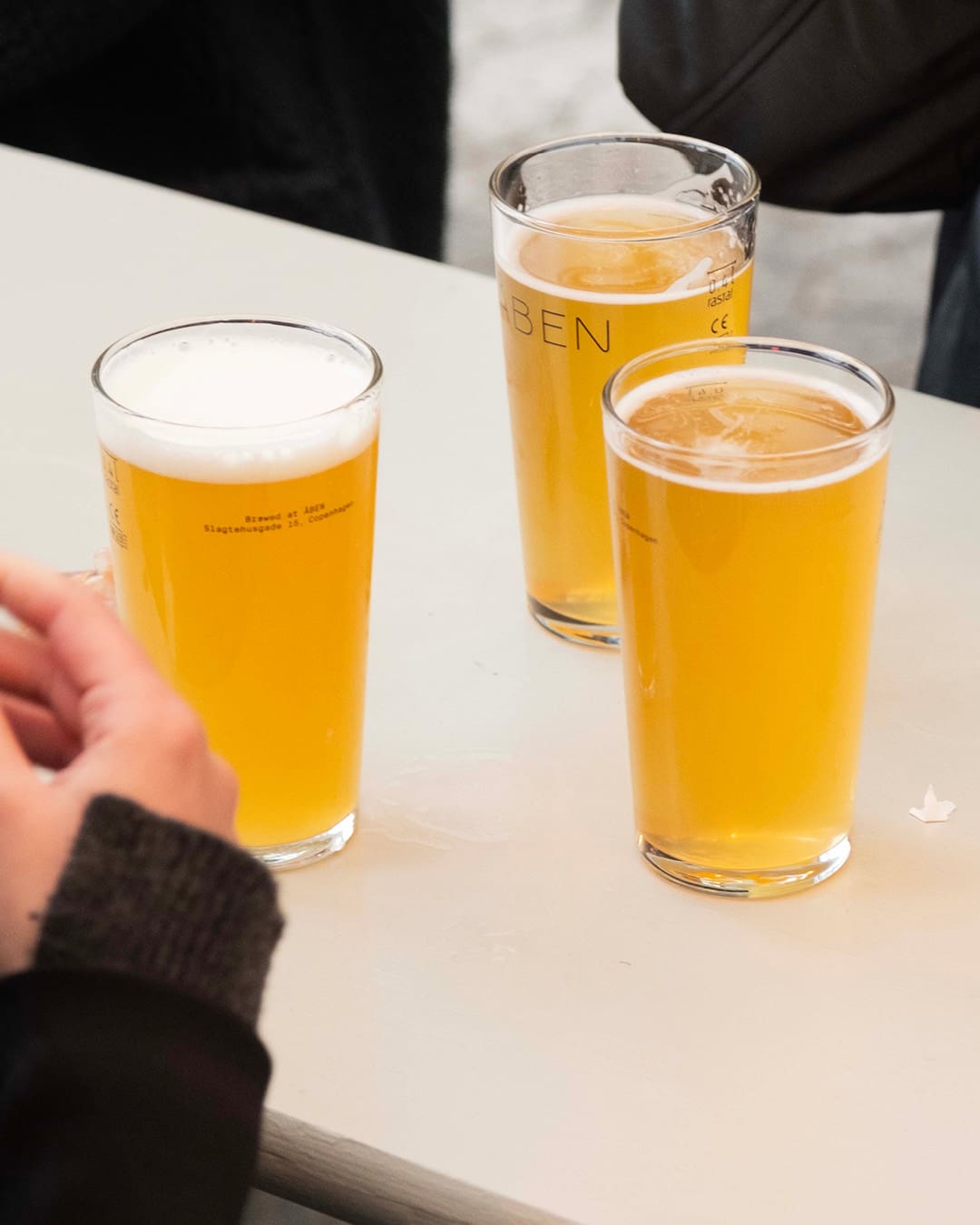 Three beers freshly poured at Åben in Copenhagen