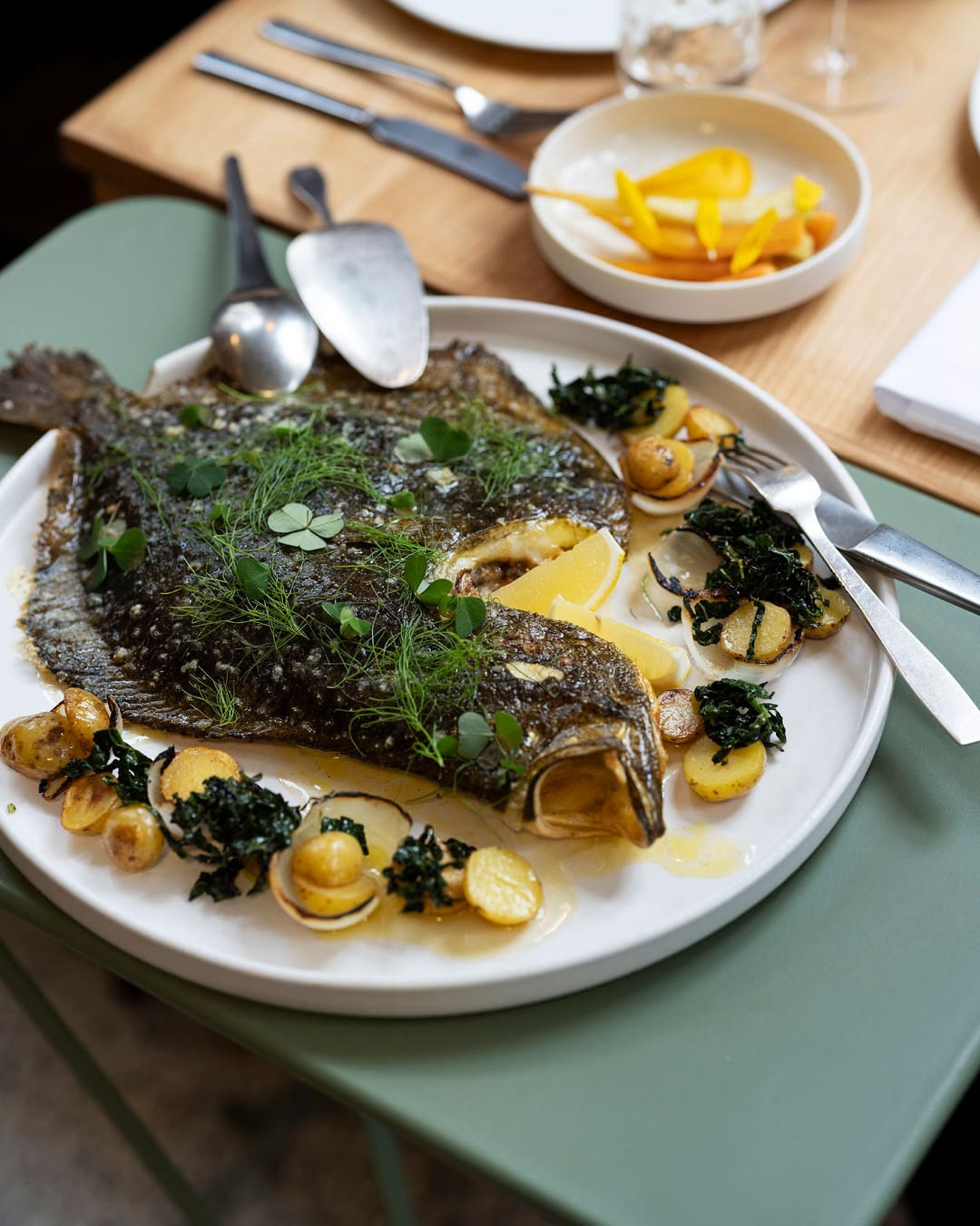 Plaice served at Admiralgade 26 on a white plate.