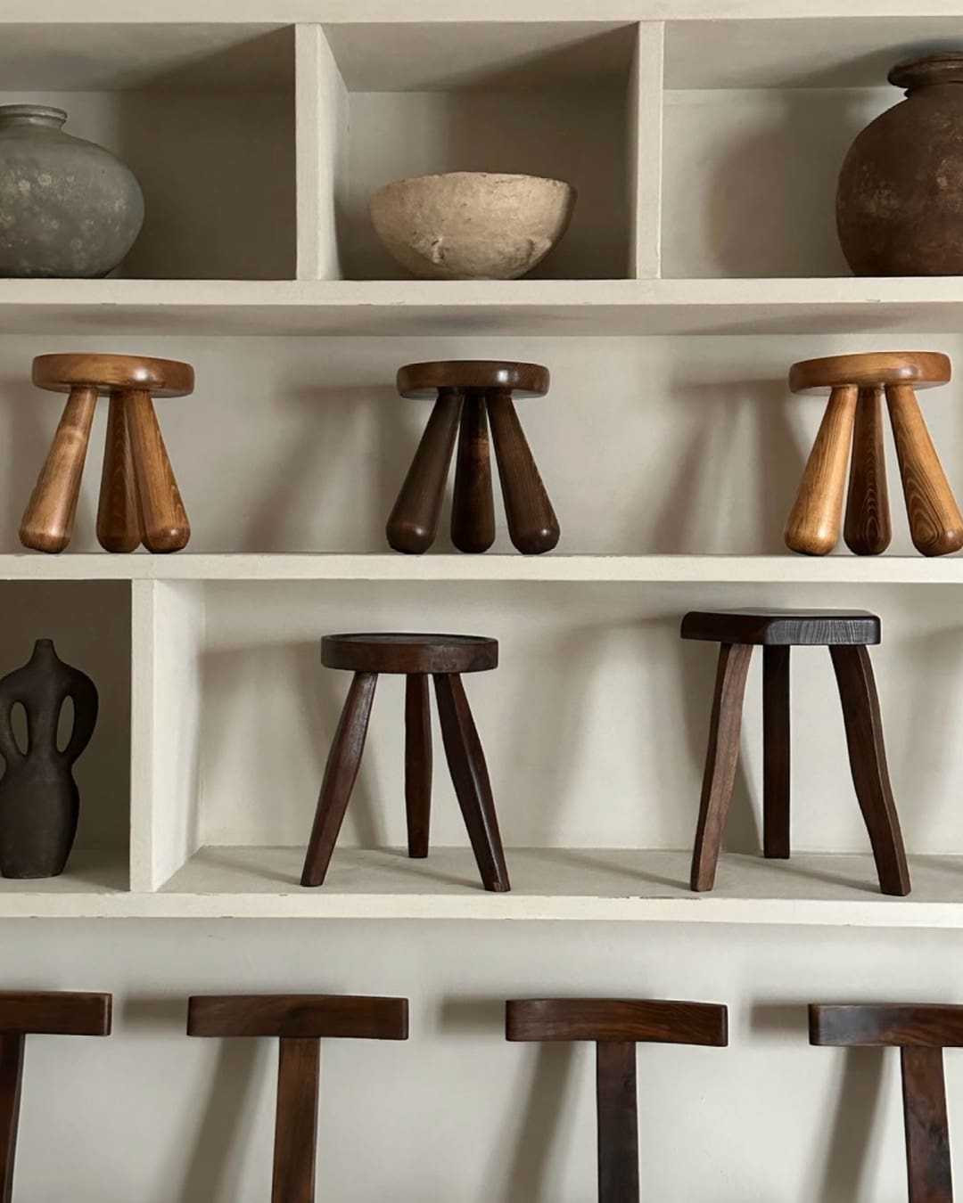 Wooden stalls and ceramic jugs on display at Ruby Atelier in Copenhagen.