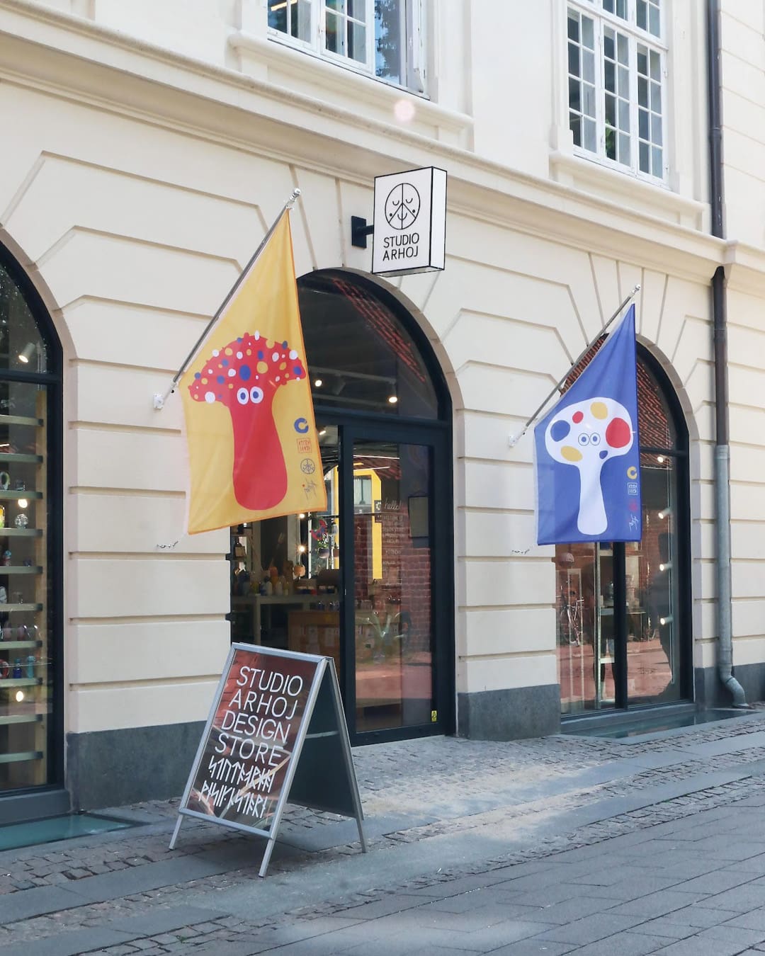 Flags hang outside Studio Arhoj's store in Copenhagen.