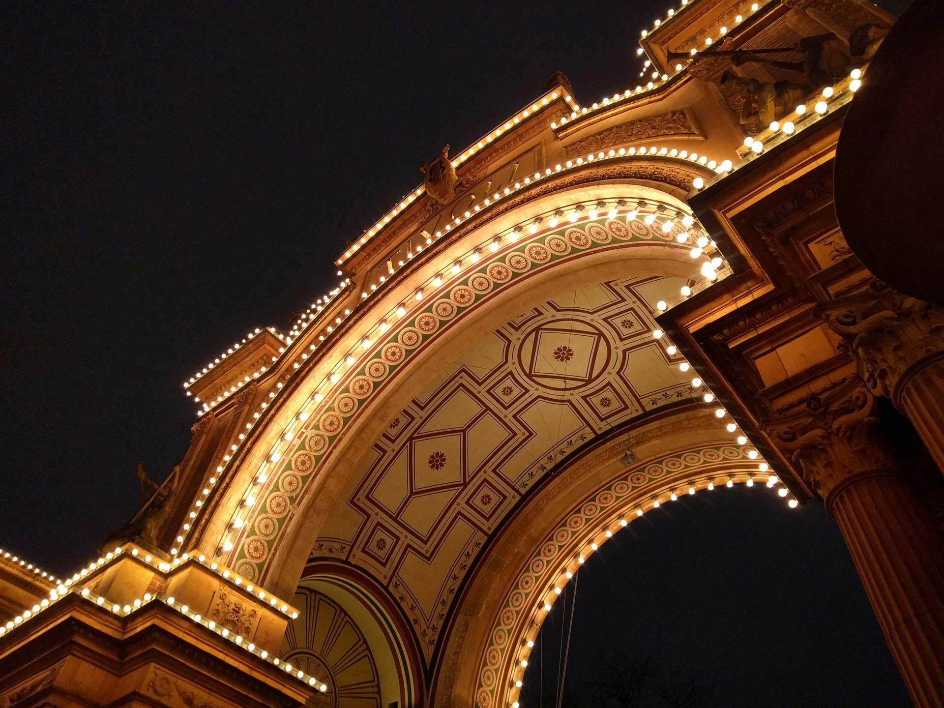 An illuminated archway in Tivoli Gardens, Copenhagen. 