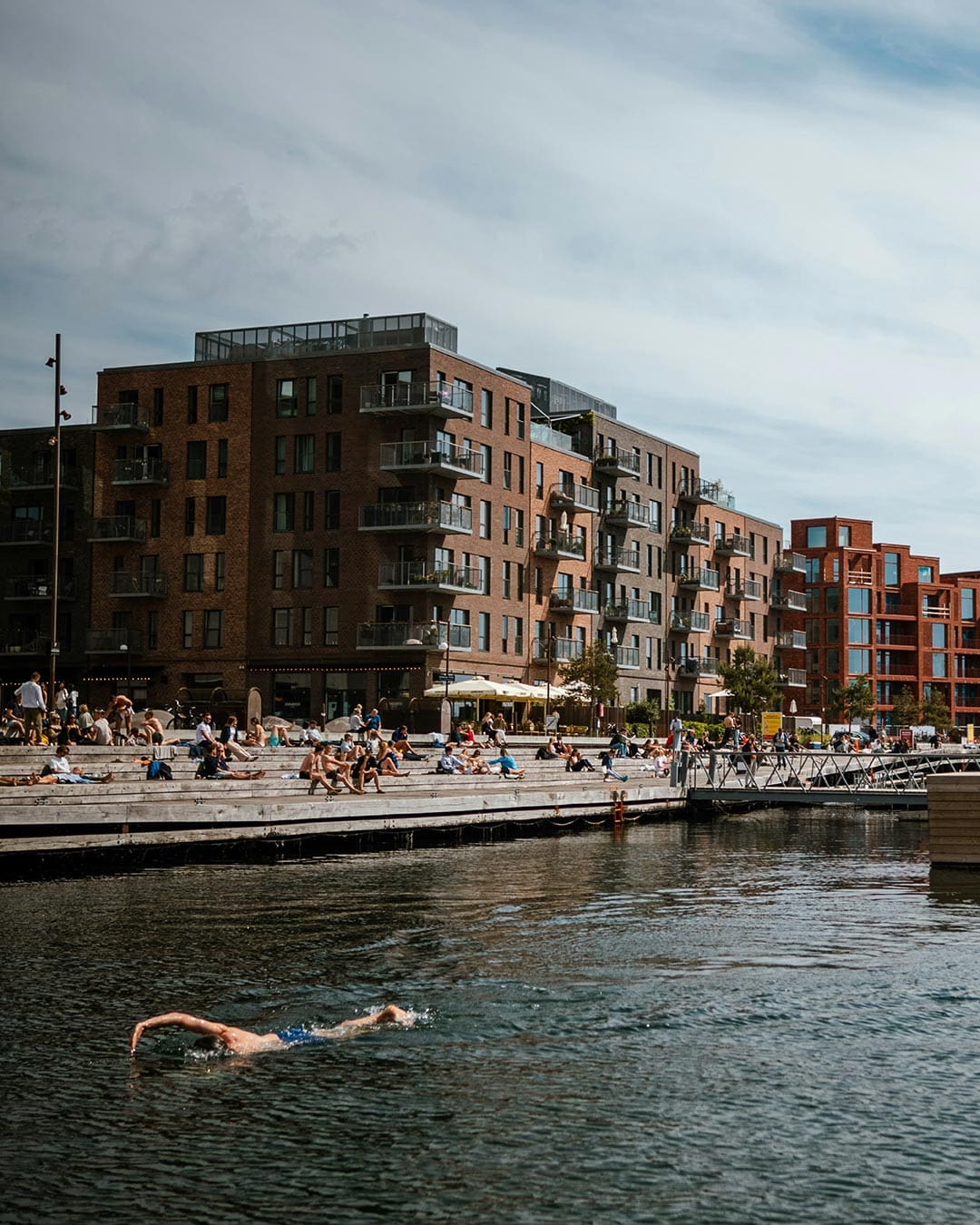 A swimmer enjoys Sandkaj Harbour bathing zone in Nordhavn, Copenhagen.