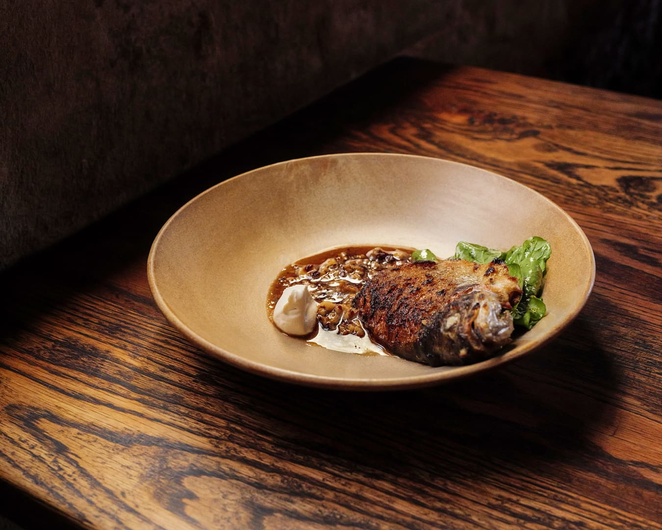 A dish of rainbow trout, hazelnut, brown butter and sorrel at Embla in CBD