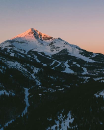 big sky mountain scene with pink sunset photo by andrew meehan portrait