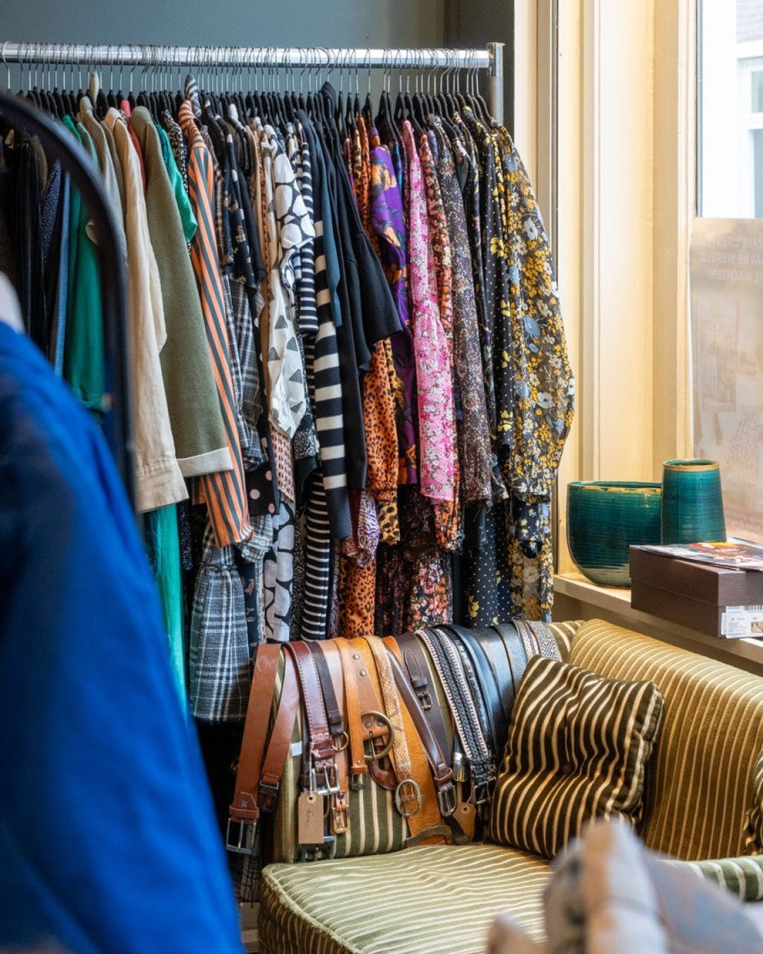 Vintage clothes on a rail at No Vintage Phobia in Utrecht.