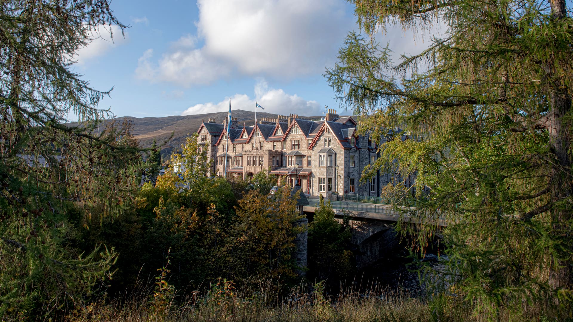 The Fife Arms set against the Cairngorms mountains