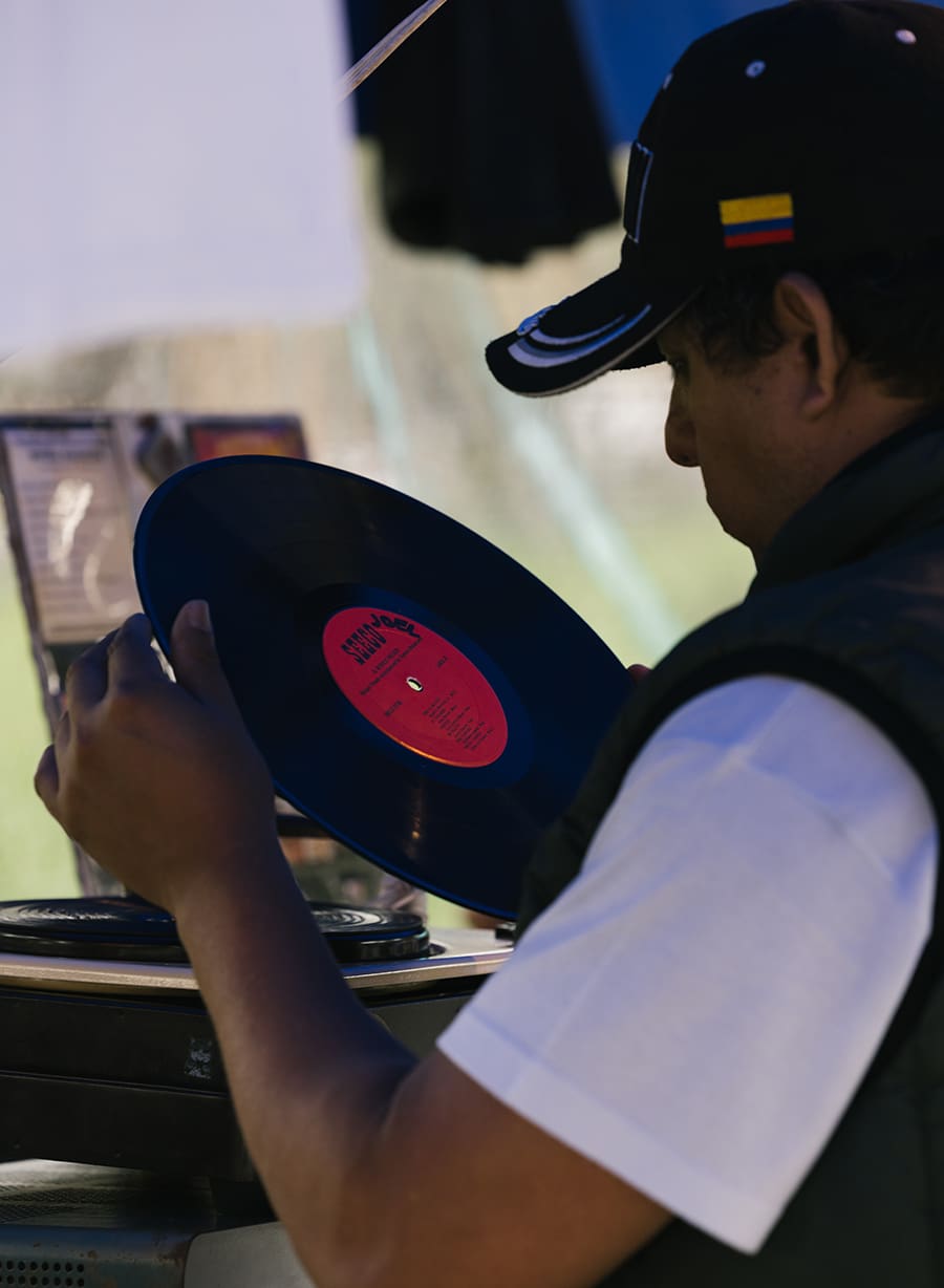 A sonidero selects a record at Kiosko Morisco, Mexico City