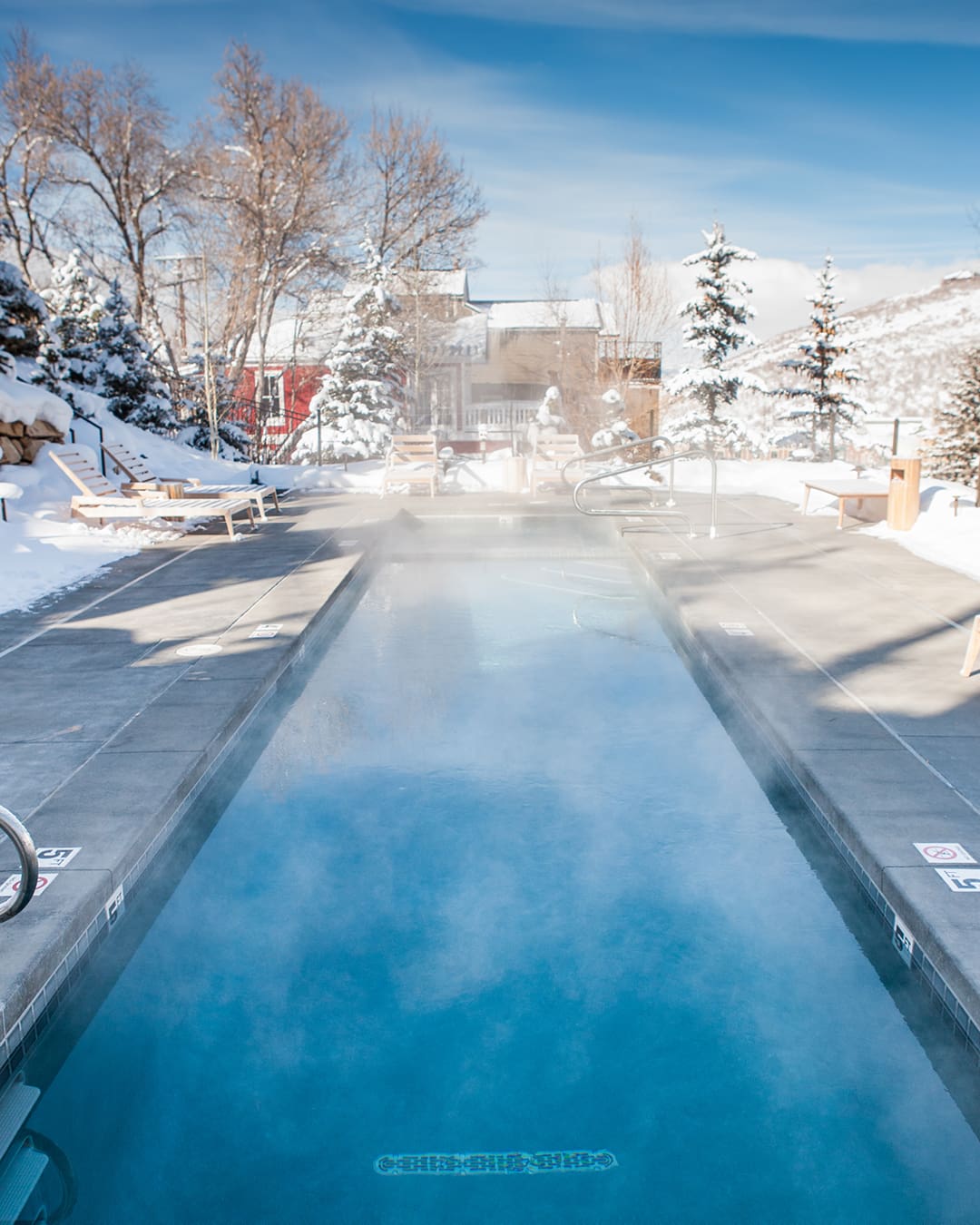 Steam rising from a pool at the Washington School House Hotel