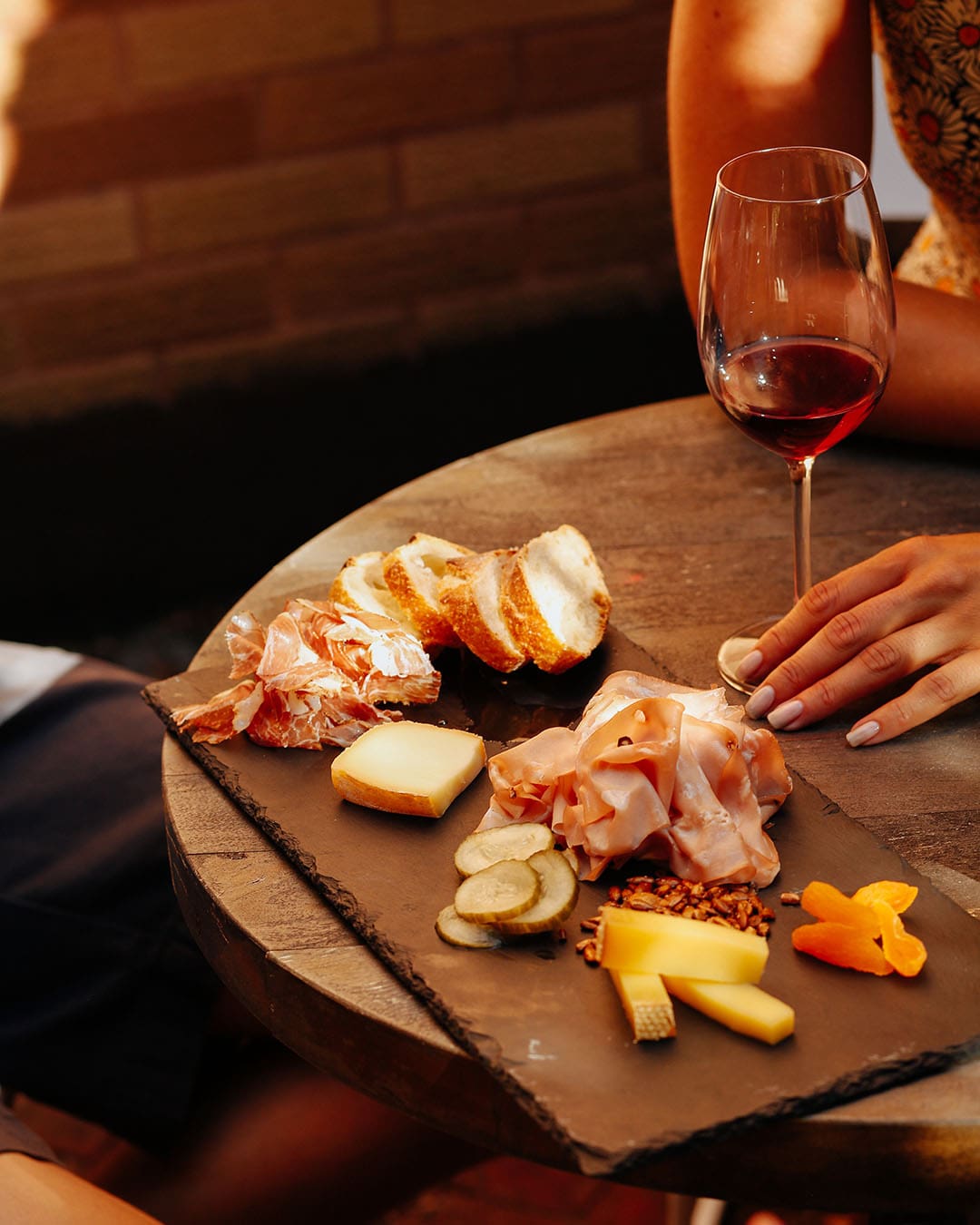 Delicious food and red wine served at Sauced, a wine bar in New York City, NYC