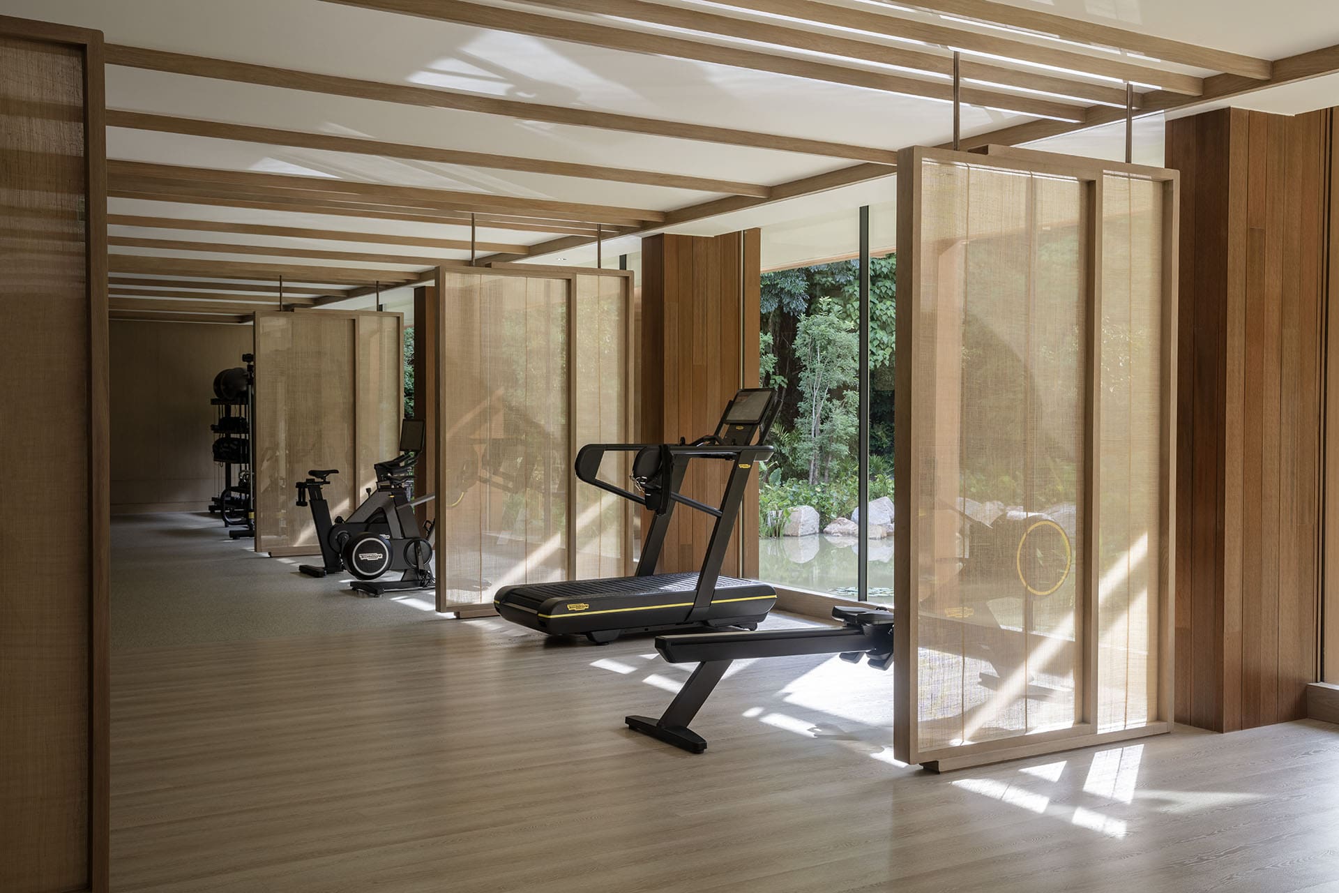 Technogym fitness equipment in a peaceful airy room at Anantara Layan hotel's gym