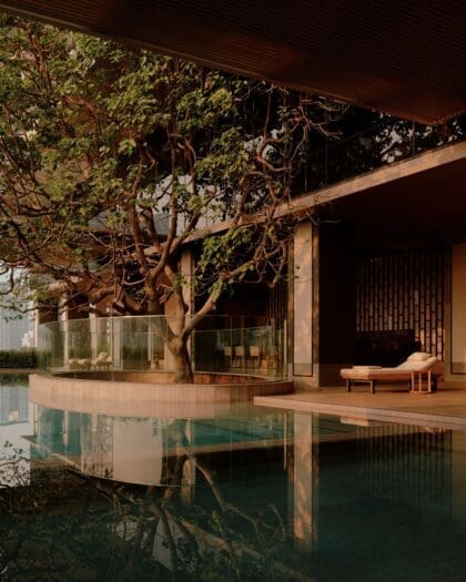 Calm pool with trees at Aman Nai Lert Bangkok, a leading hotel in the city for wellness travel