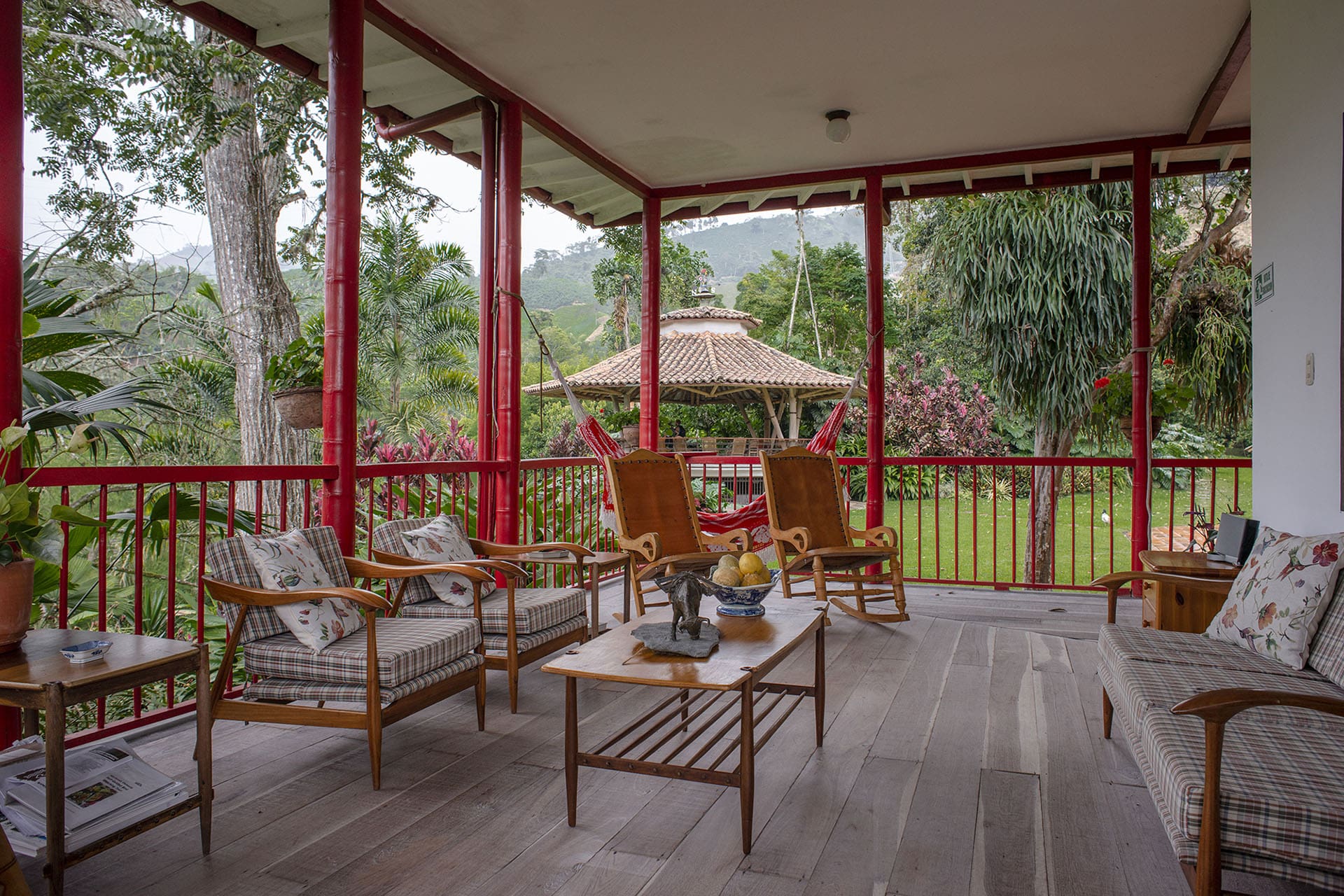 Red framework pops against the green landscape at Hacienda Venecia