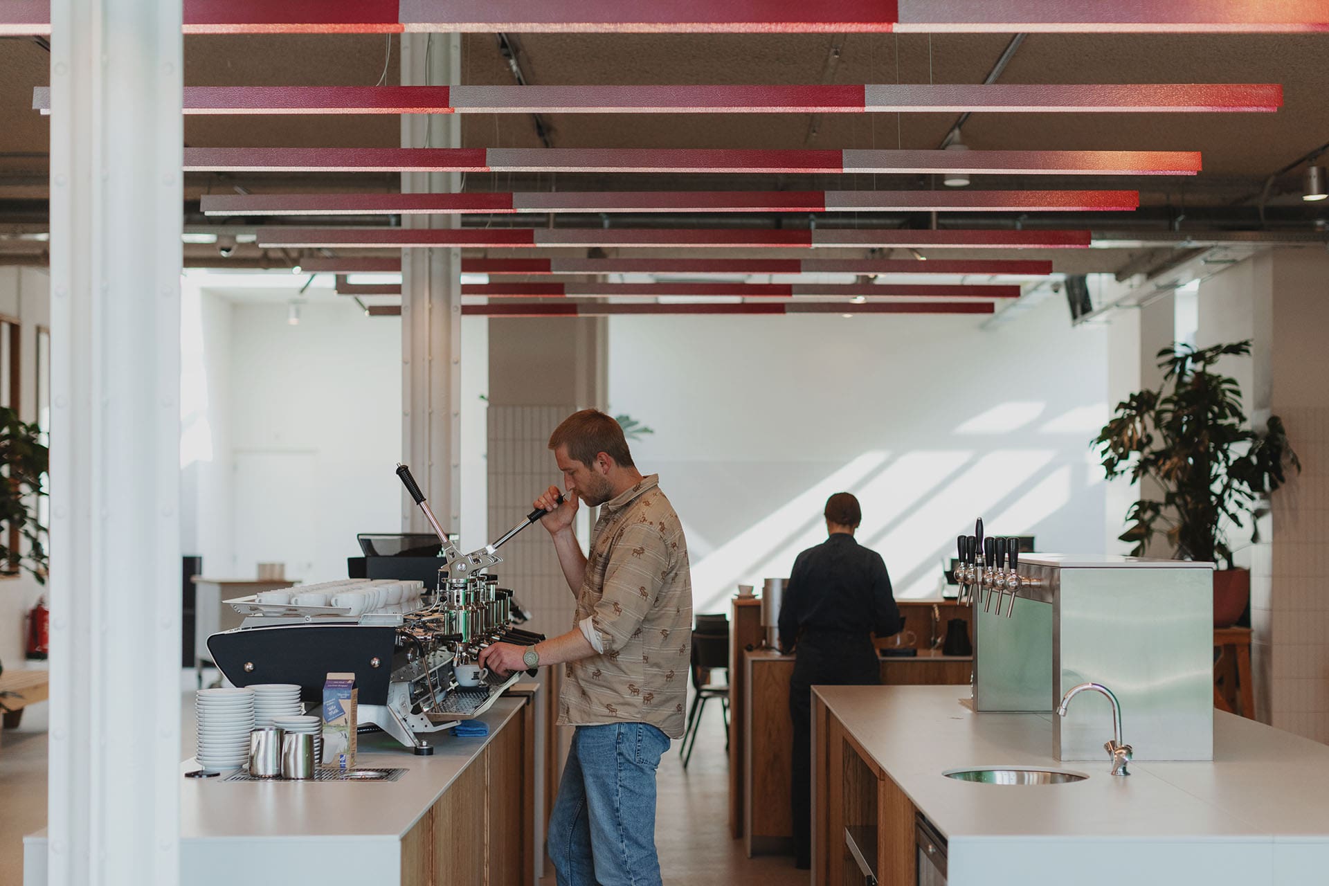 Baristas work at Man Met Bril Koffie, Rotterdam