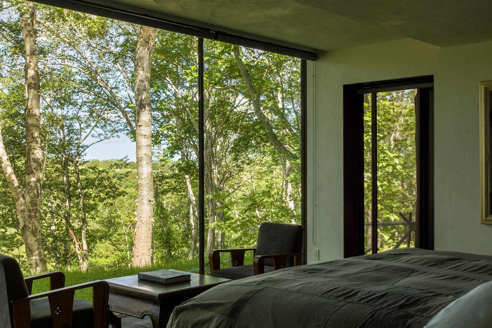 One of the Shiguchi bedrooms with a spectacular view of the forest surrounds