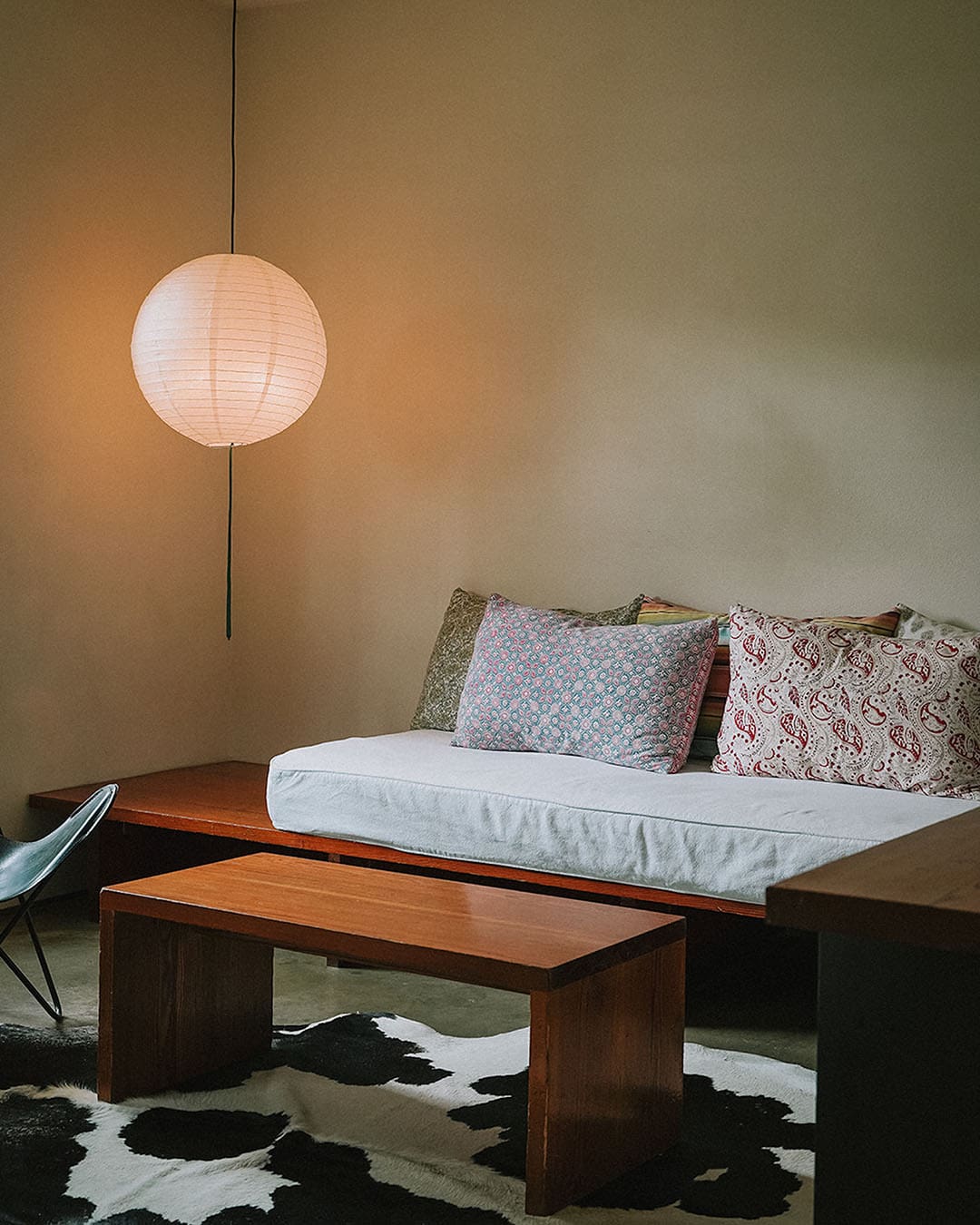 A cowhide rug and sofat at Hotel San Jose. Photography by Cristina Fisher
