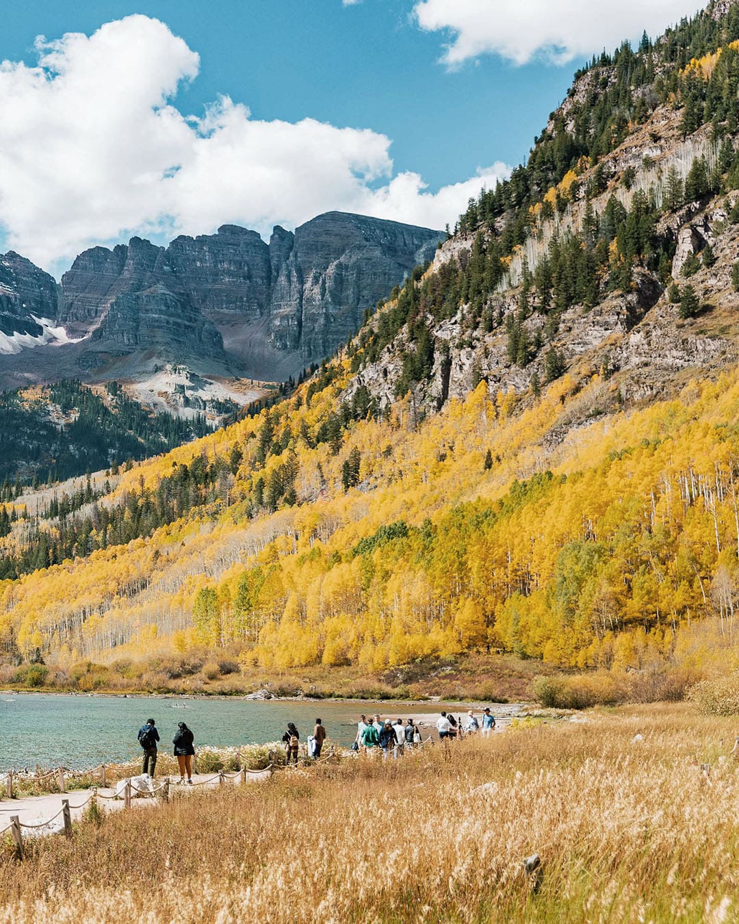Lake views of Aspen in Colorado. People walking along path