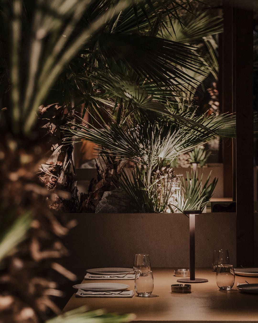 Palm-fringed interiors at Le Canoë at Holiday Beach Resort