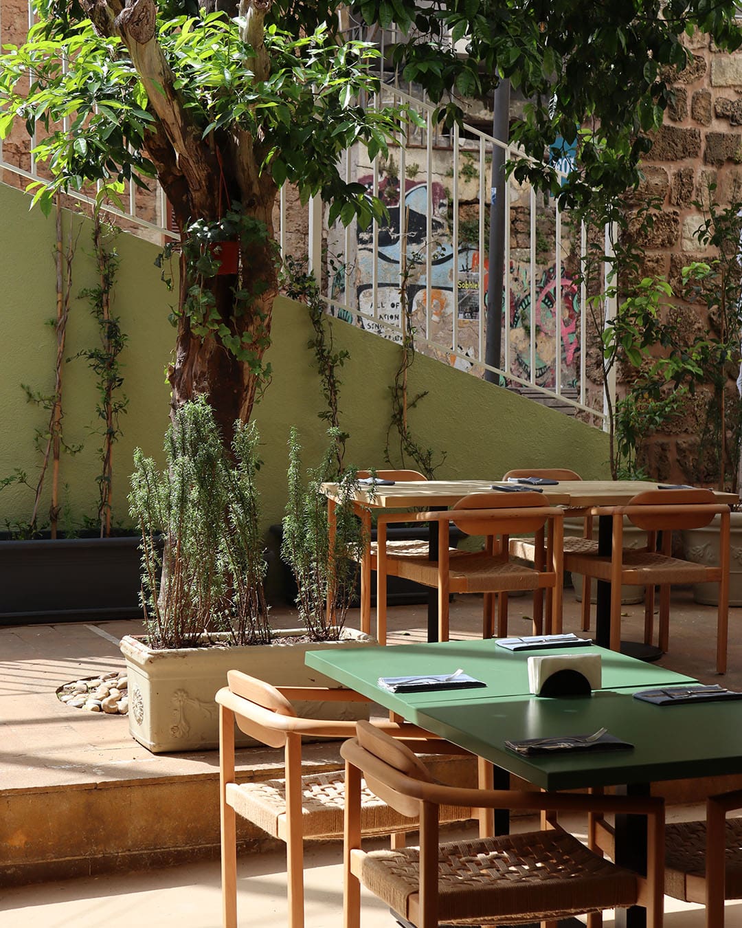 Serene outdoor seating at Un Peu Fou in Beirut